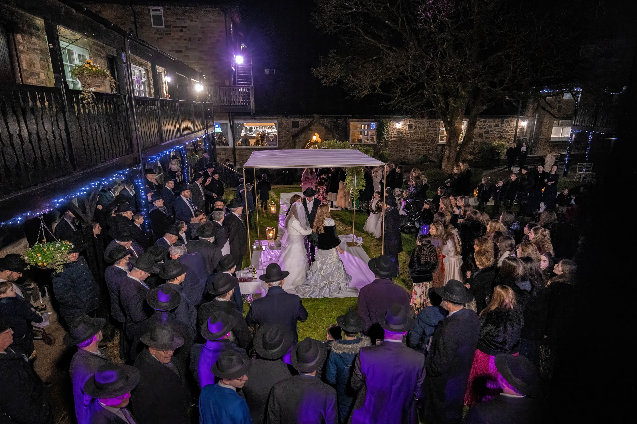 outdoor night time chuppah at charedi jewish wedding ceremony