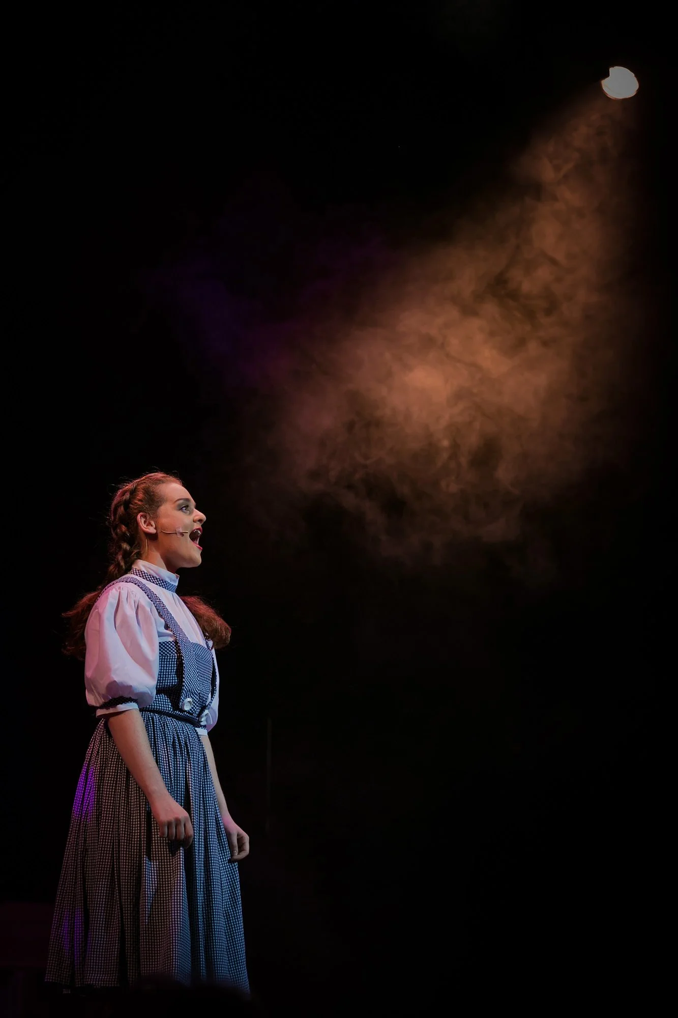 dorothy in wizard of oz production on stage theatre performance dramatic photography portrait with make-up and costume