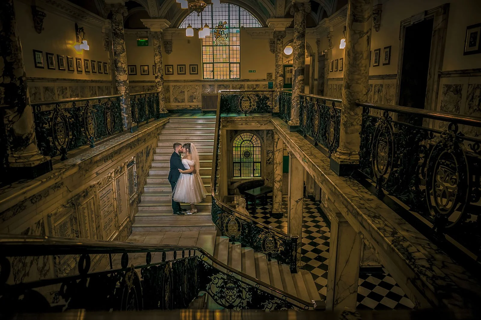 Romantic couple portrait on stairs of Stockport Town Hall in Manchester
