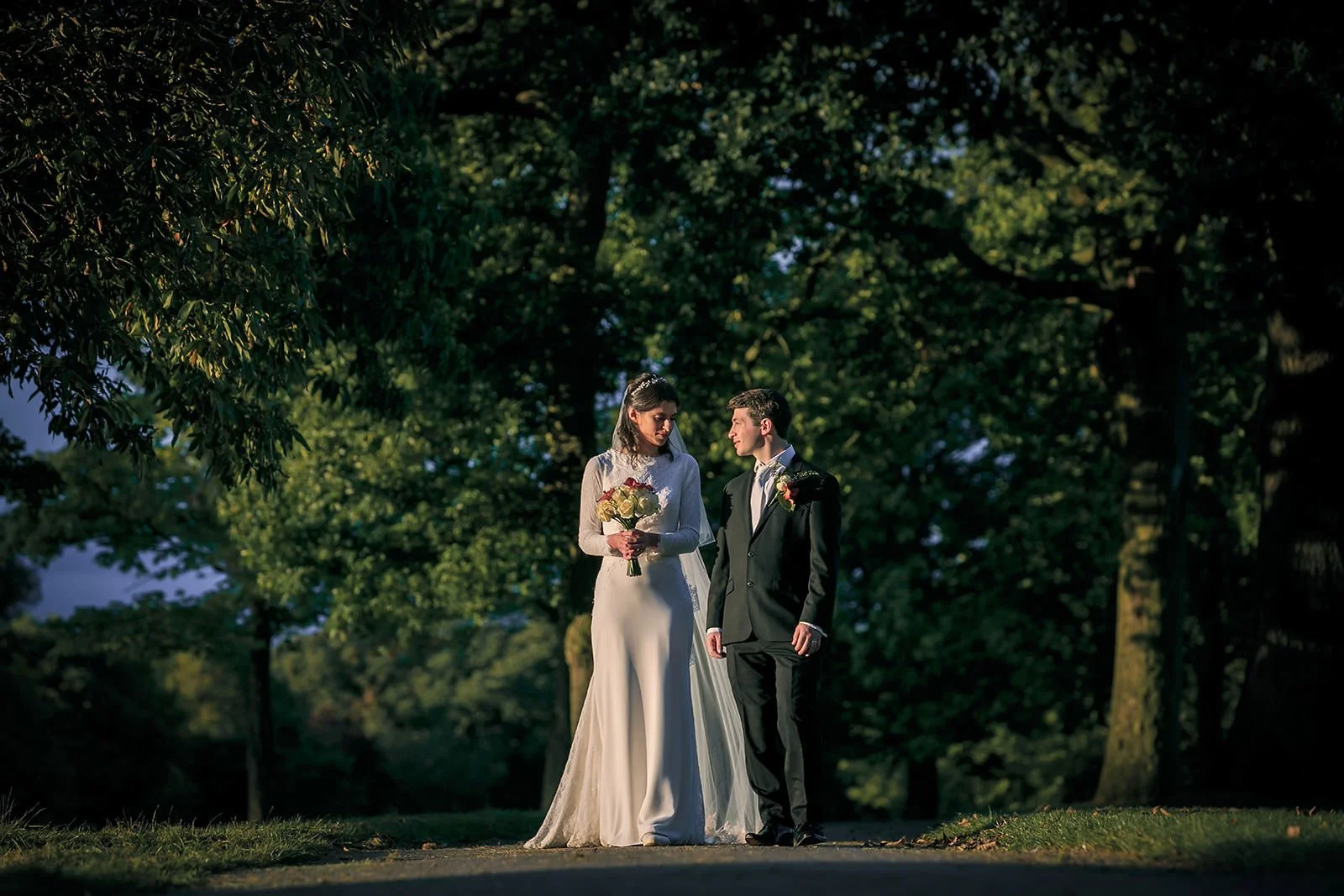 golden hour bride groom newlywed couple portrait during wedding at mere golf resort in cheshire