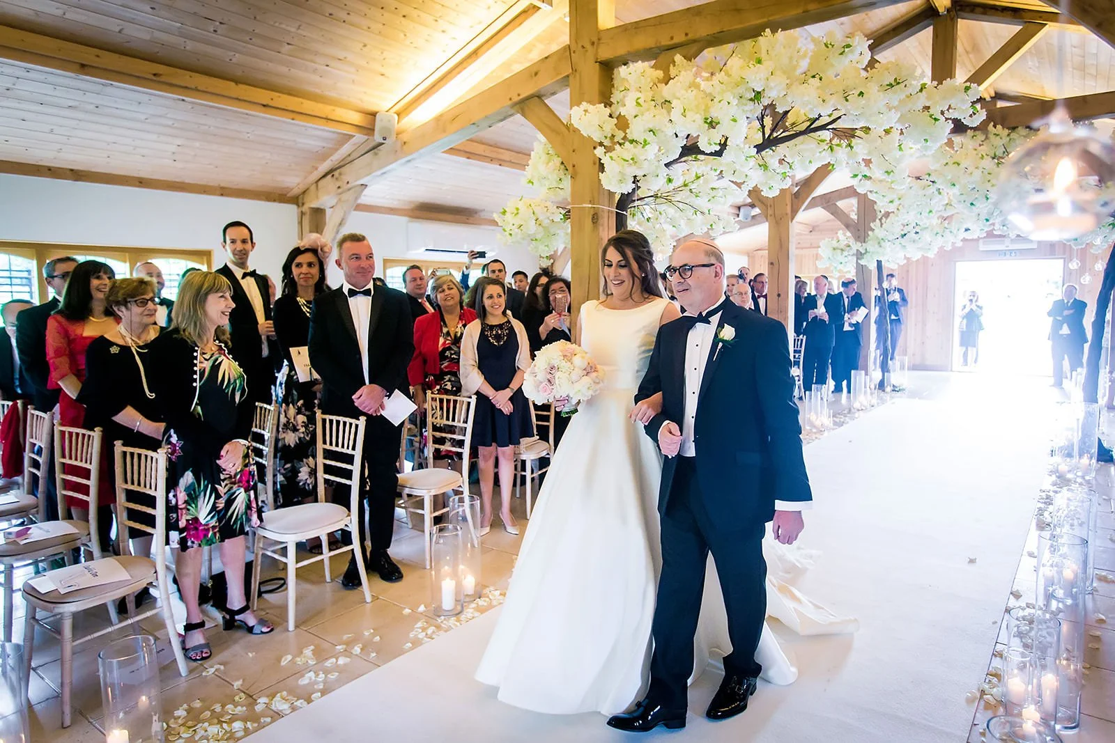 bride walks down aisle with dad during ceremony at colshaw hall in cheshire