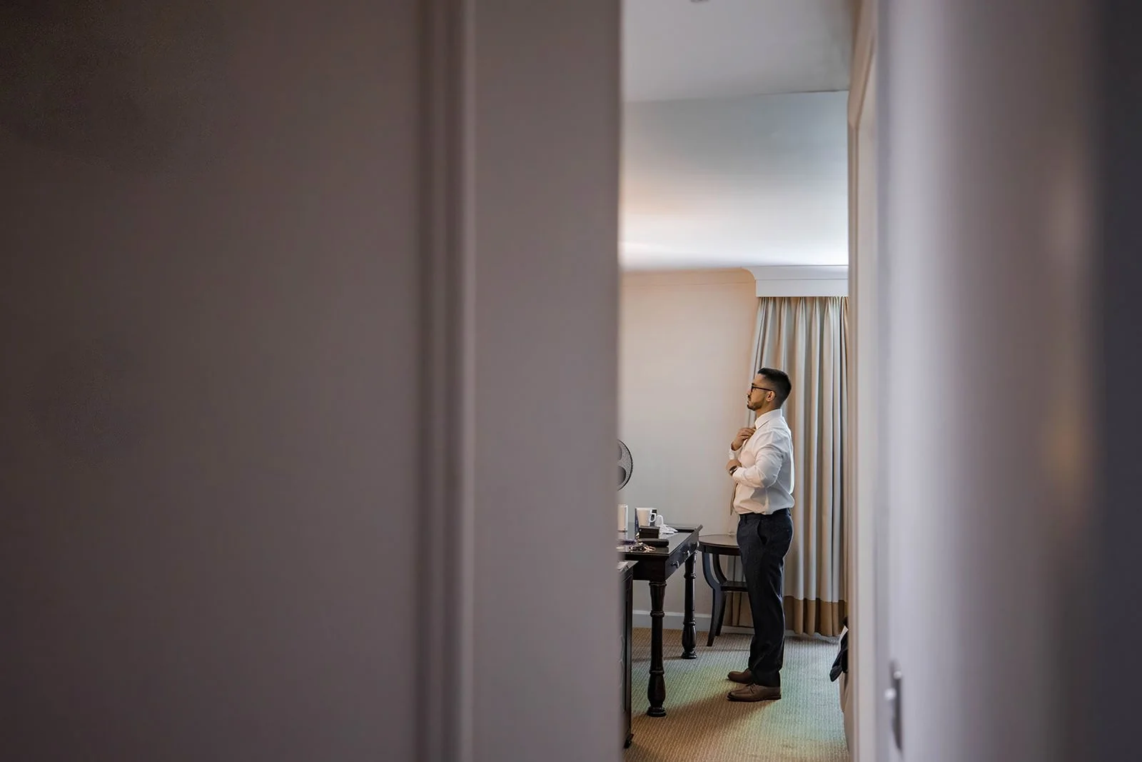 groom getting ready during prep at worsley marriott hotel wedding venue