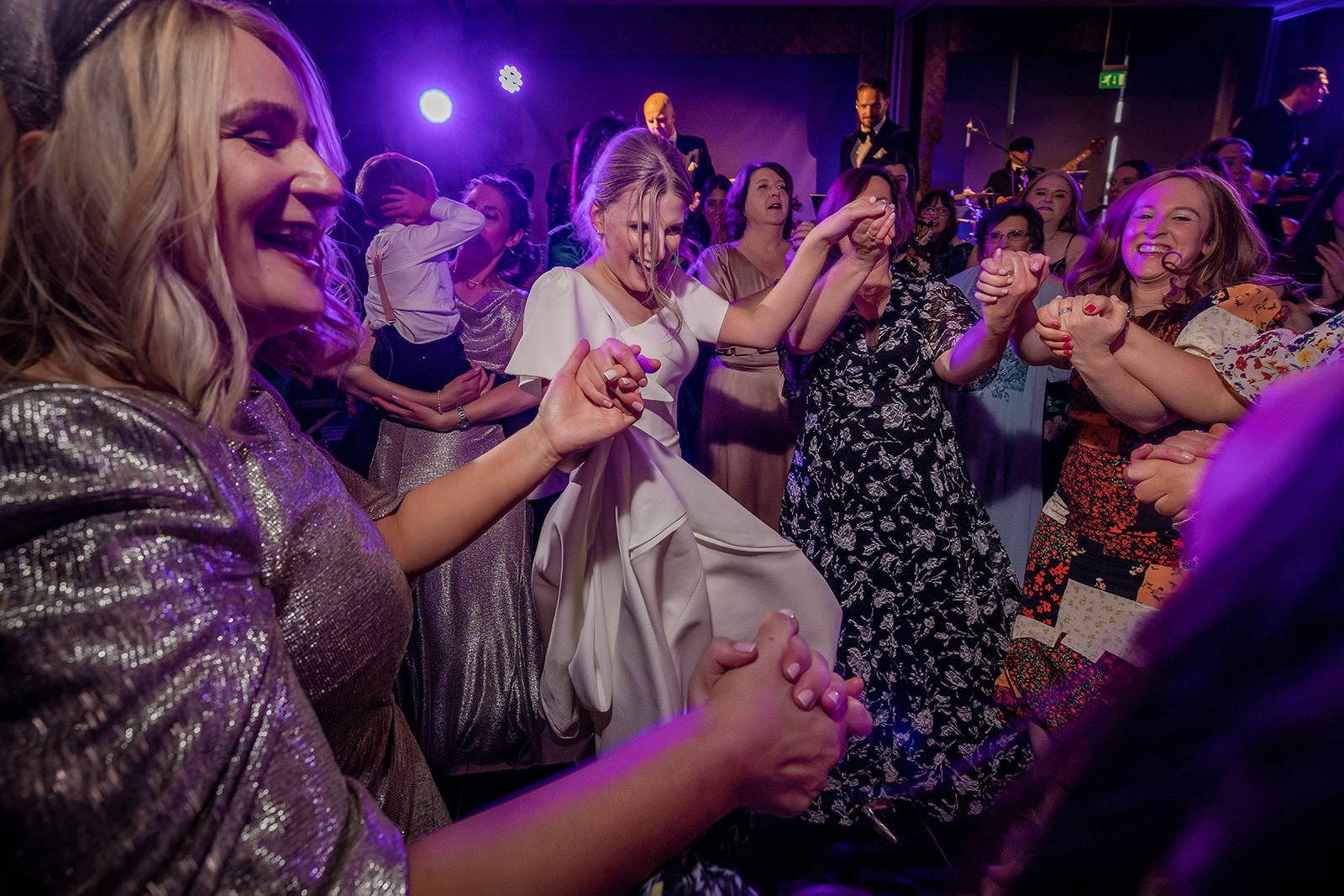 Evening dancing with guests and bride, Fairmont Cheshire - The Mere reception
