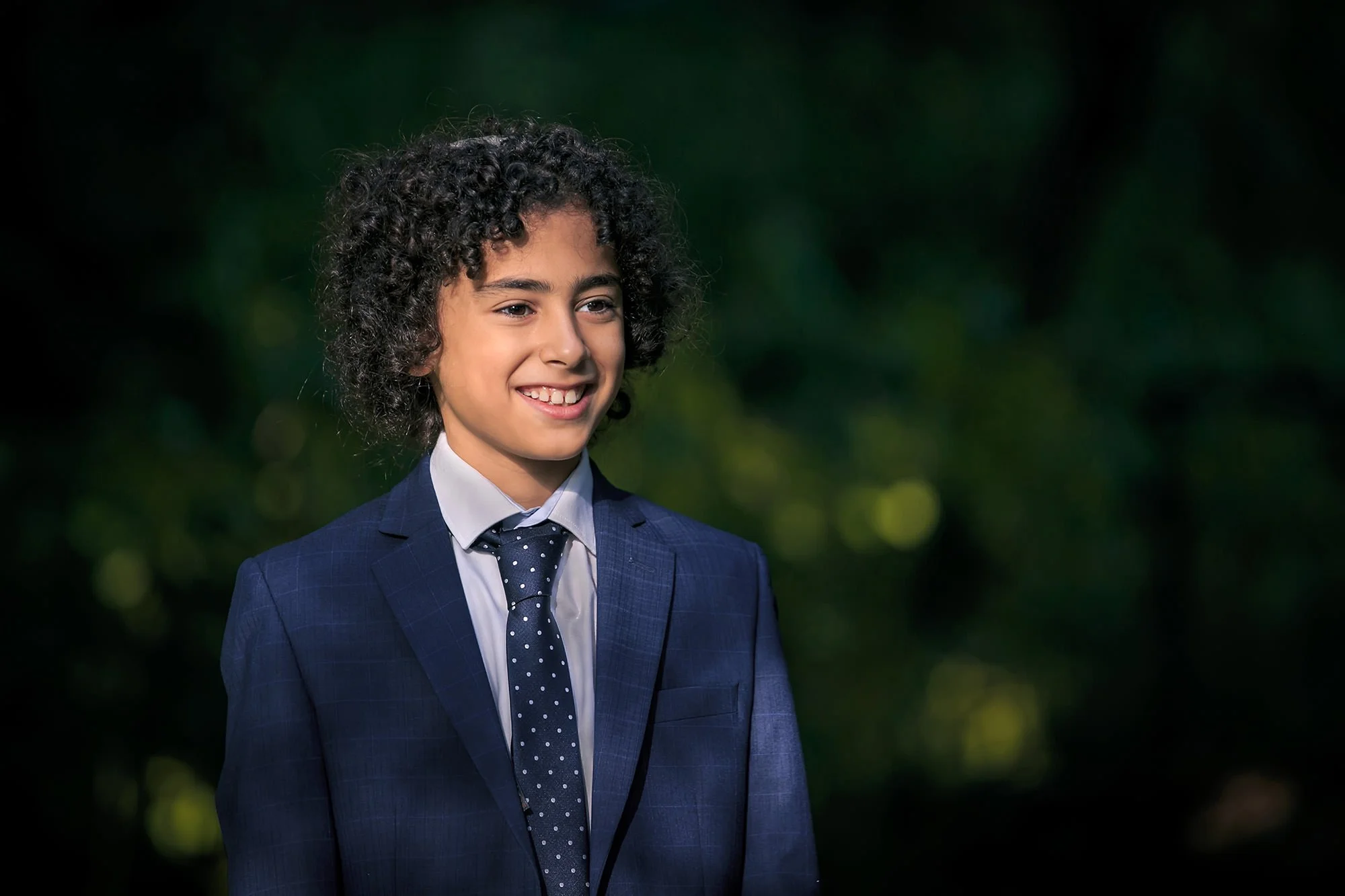 natural light formal portrait of boy in park