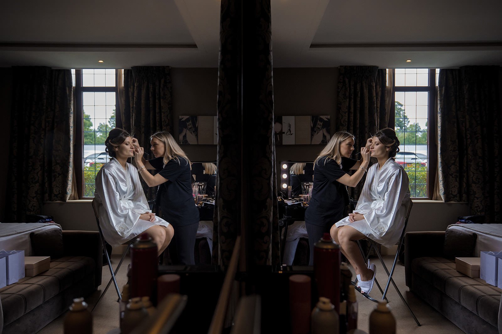 bride having make up applied during prep at mere golf resort in cheshire