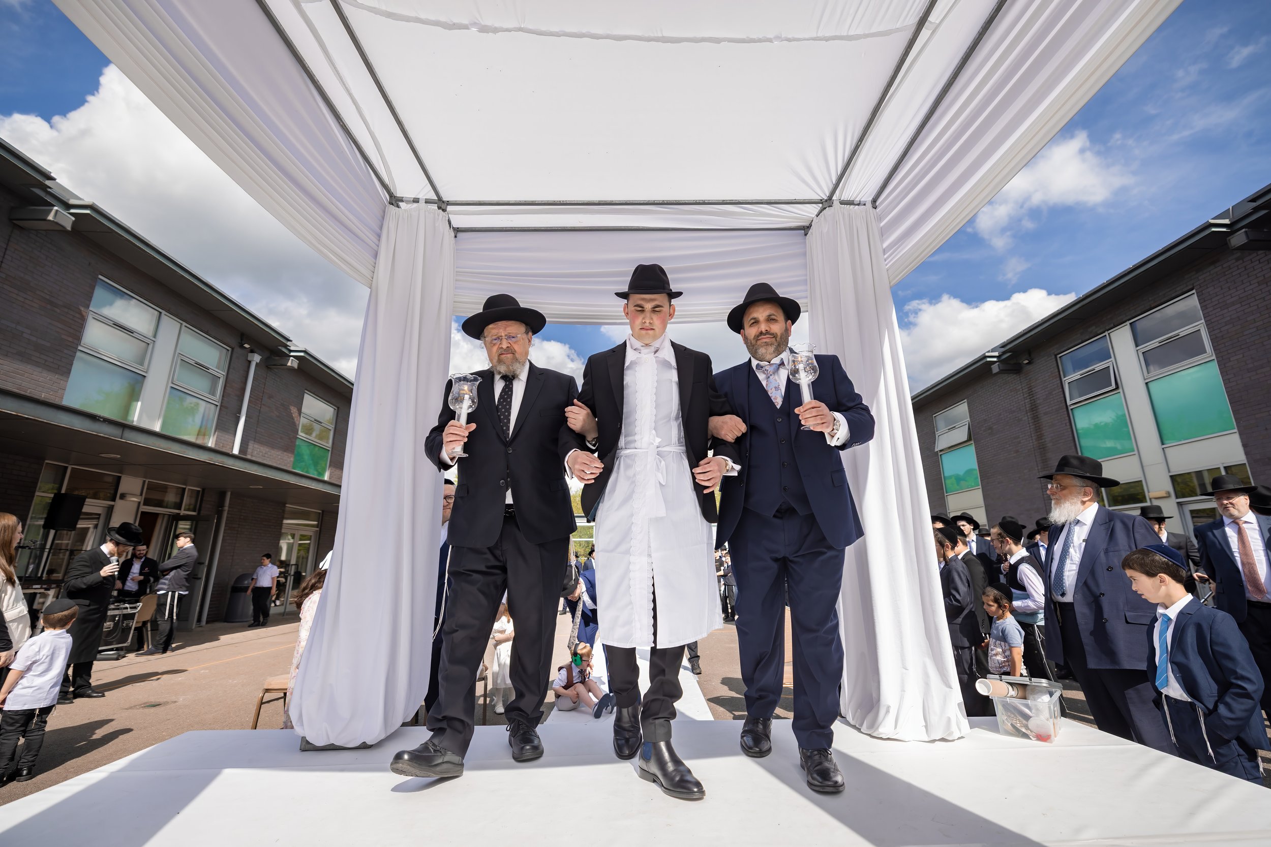 chosson groom under chuppah at charedi jewish wedding ceremony