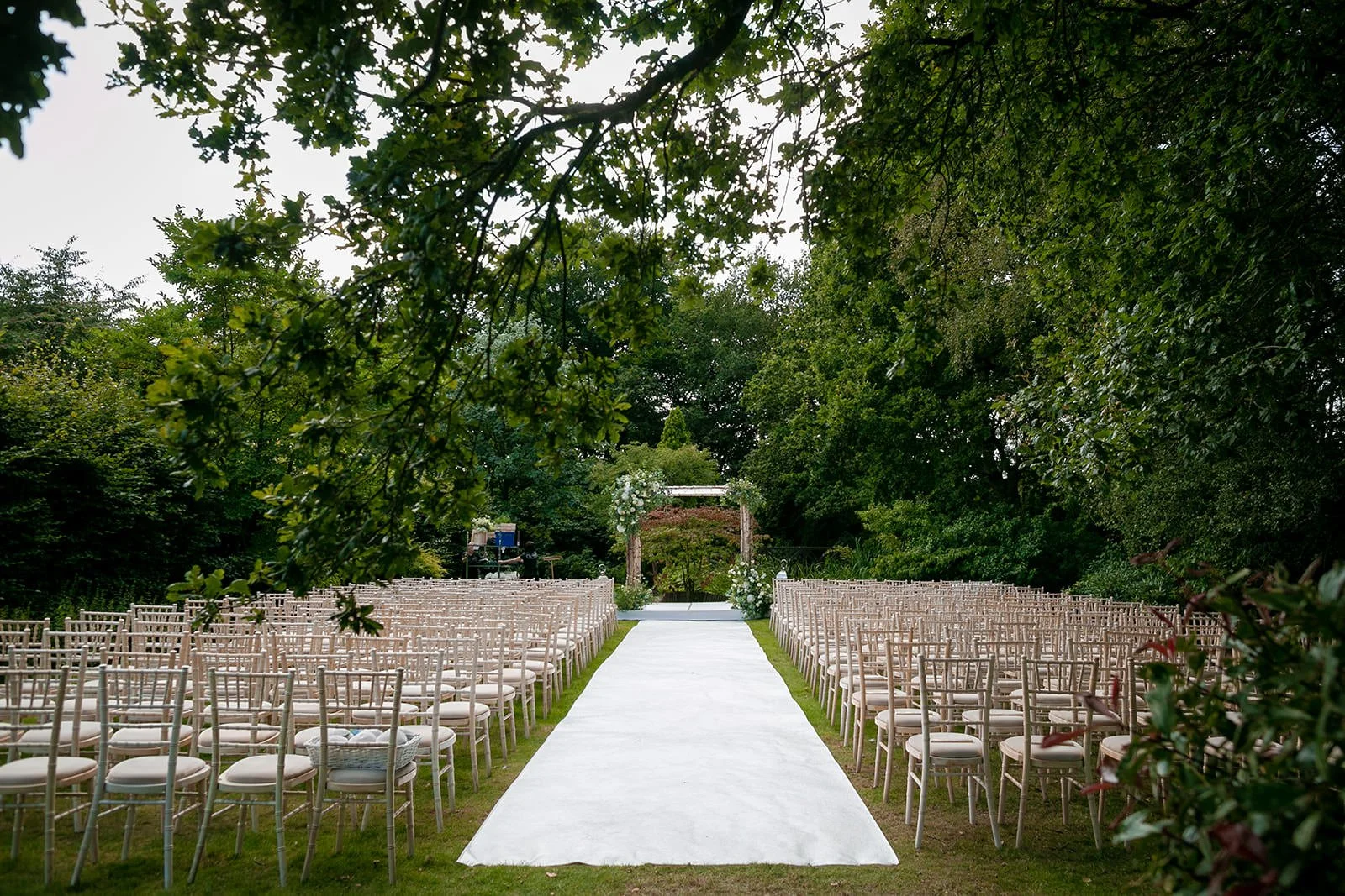outdoor wedding ceremony set up in Italian gardens at nunsmere hall venue in cheshire
