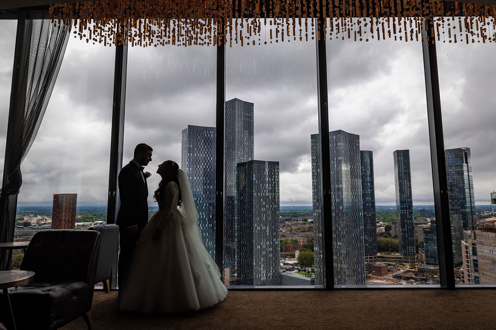 silhouette romantic newlywed bride and groom couple portrait on cloud 23 in manchester deansgate hotel