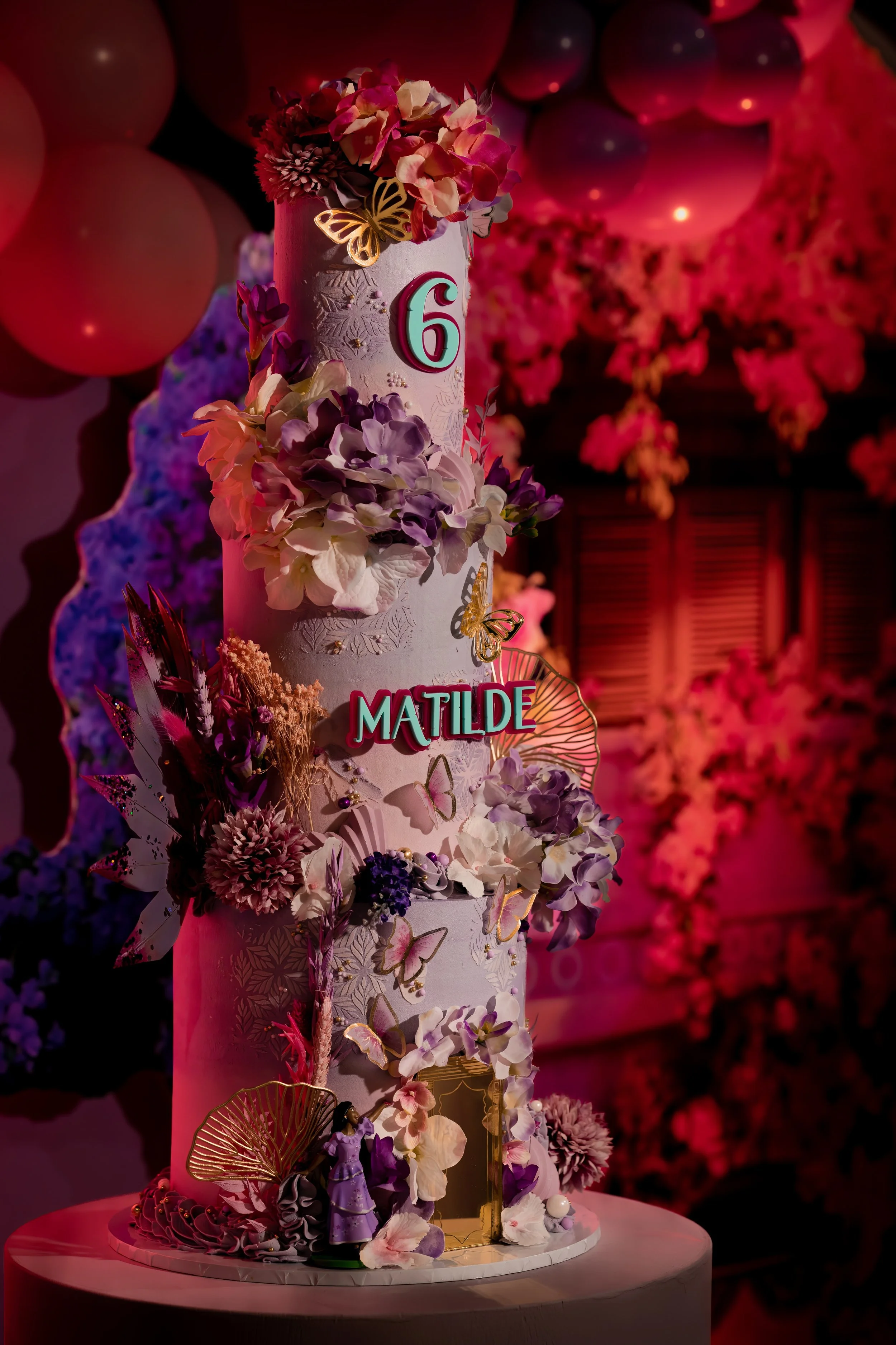 Detail shot of extravagant Encanto themed birthday cake for Matilde