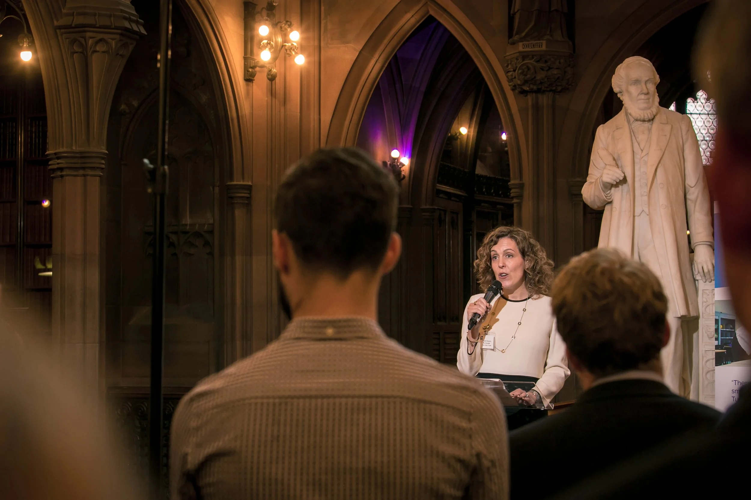 Audience listening to a speaker at a leadership event in Manchester