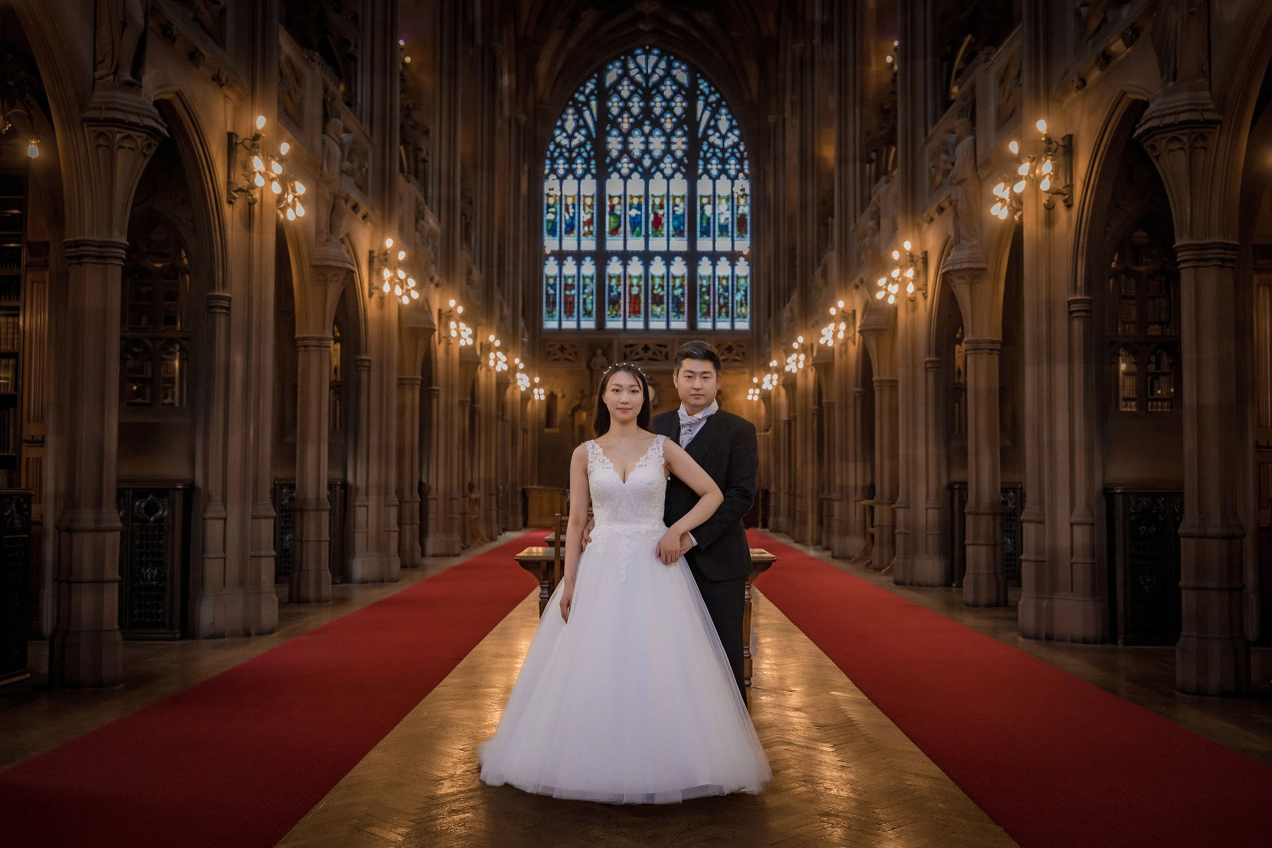 Classic newlywed bride and groom portrait in gothic Manchester John Ryland Library