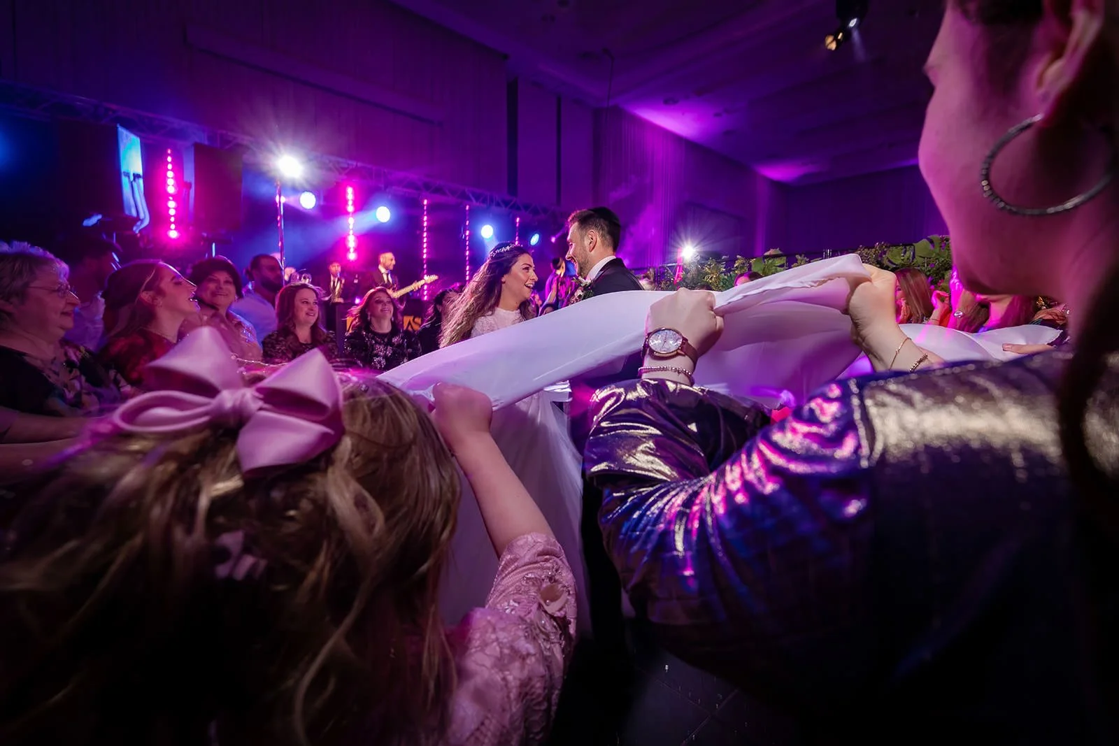groom lifted dancing at wedding reception dance floor at manchester deansgate hotel