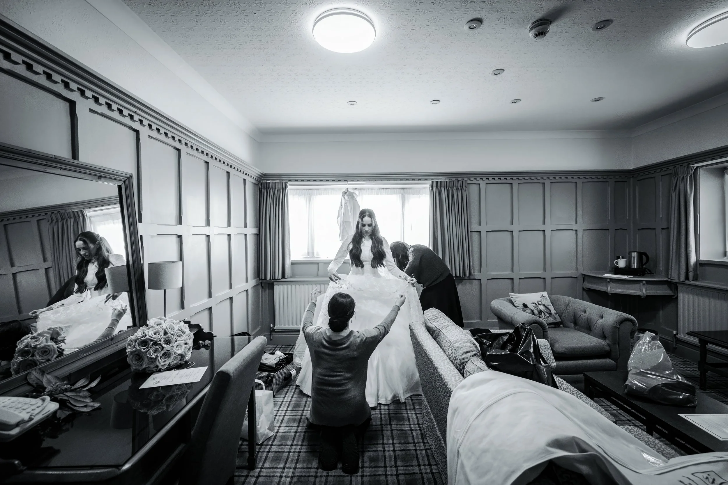 kallah bride getting into dress during prep at charedi wedding