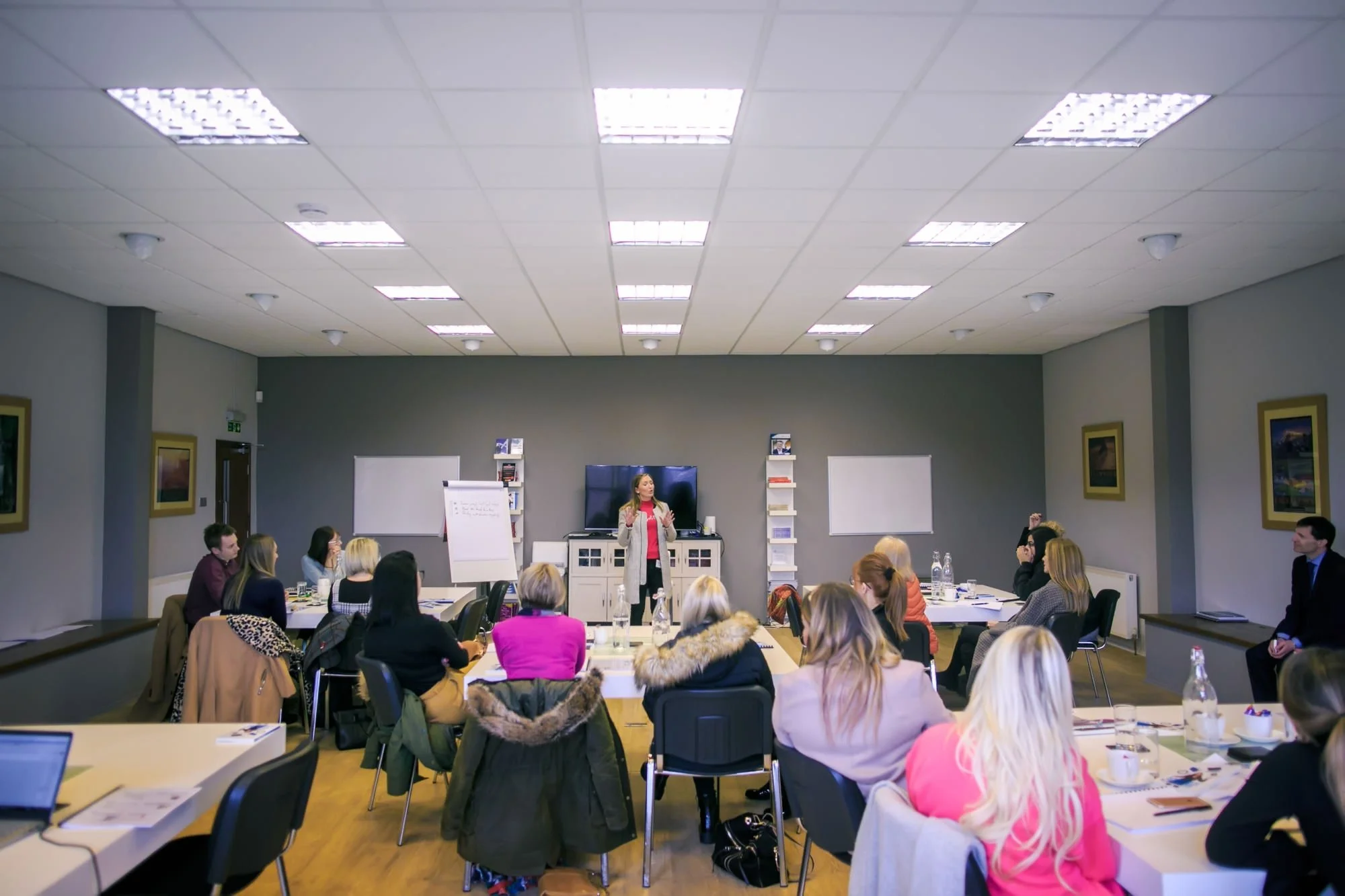 Speaker presenting to attendees at a business training workshop