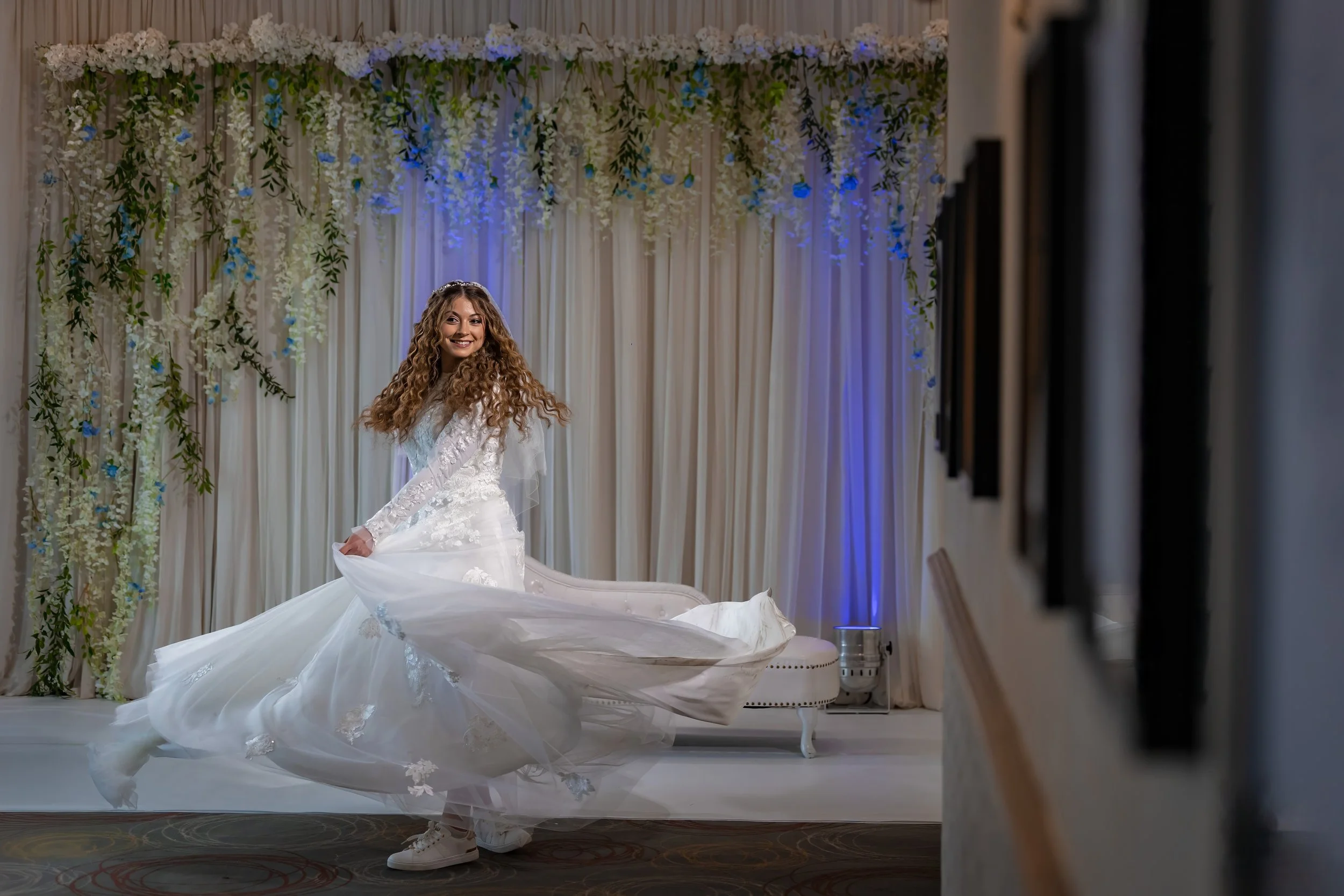 Jewish manchester wedding photographer captures a jewish bride spinning in her dress during bedeken
