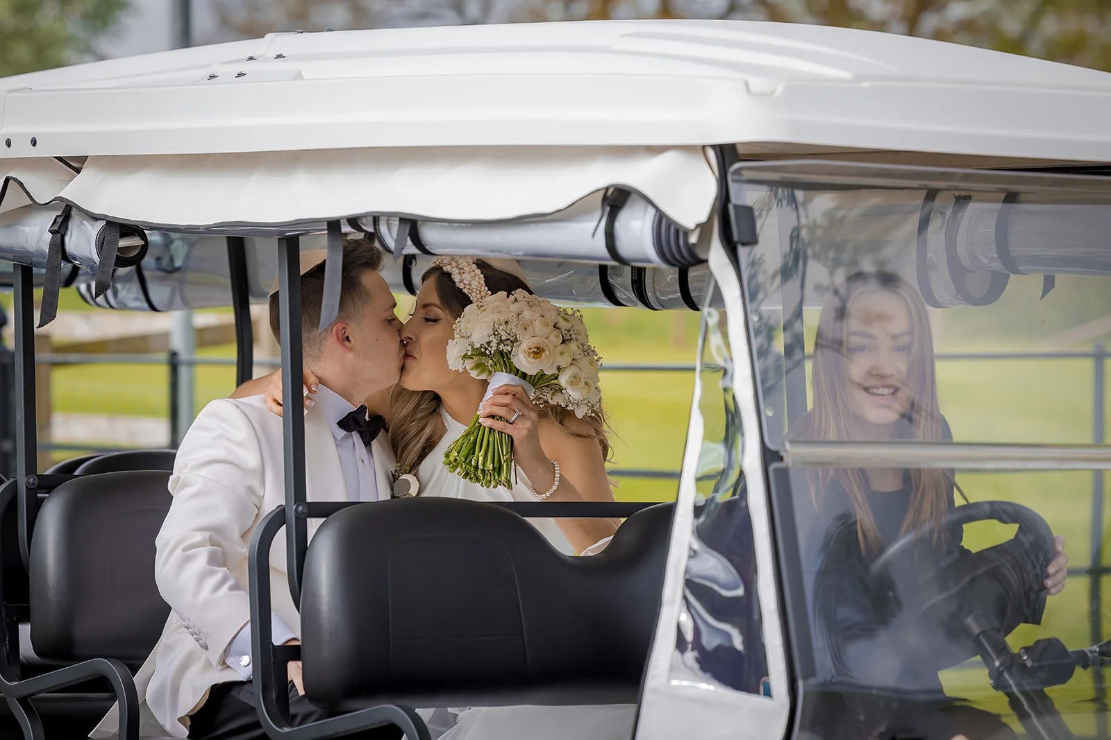 Merrydale Manor wedding couple kissing in golf cart – fine art wedding photographer North West