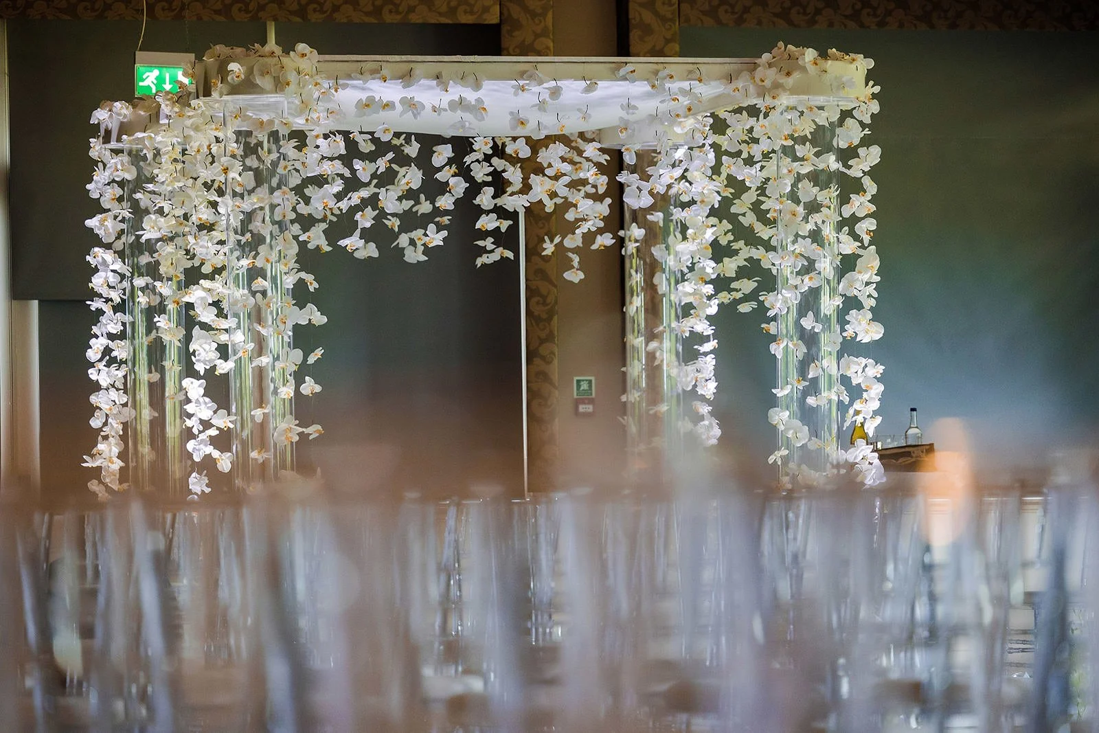 Elaborate white chuppah with cascading floral decoration, The Mere Jewish wedding
