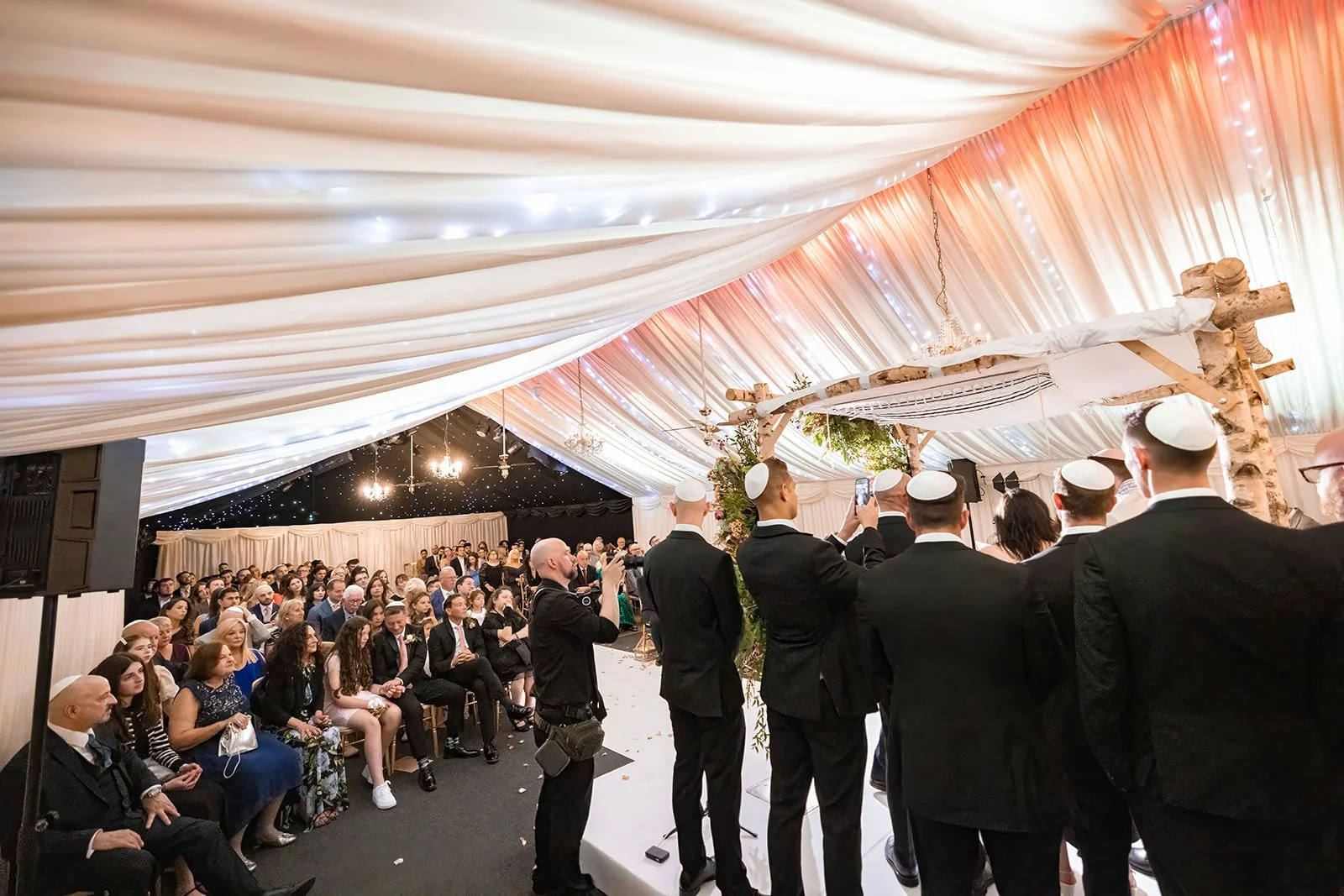 bride and groom exchange vows during wedding ceremony at heaton house farm in macclesfield