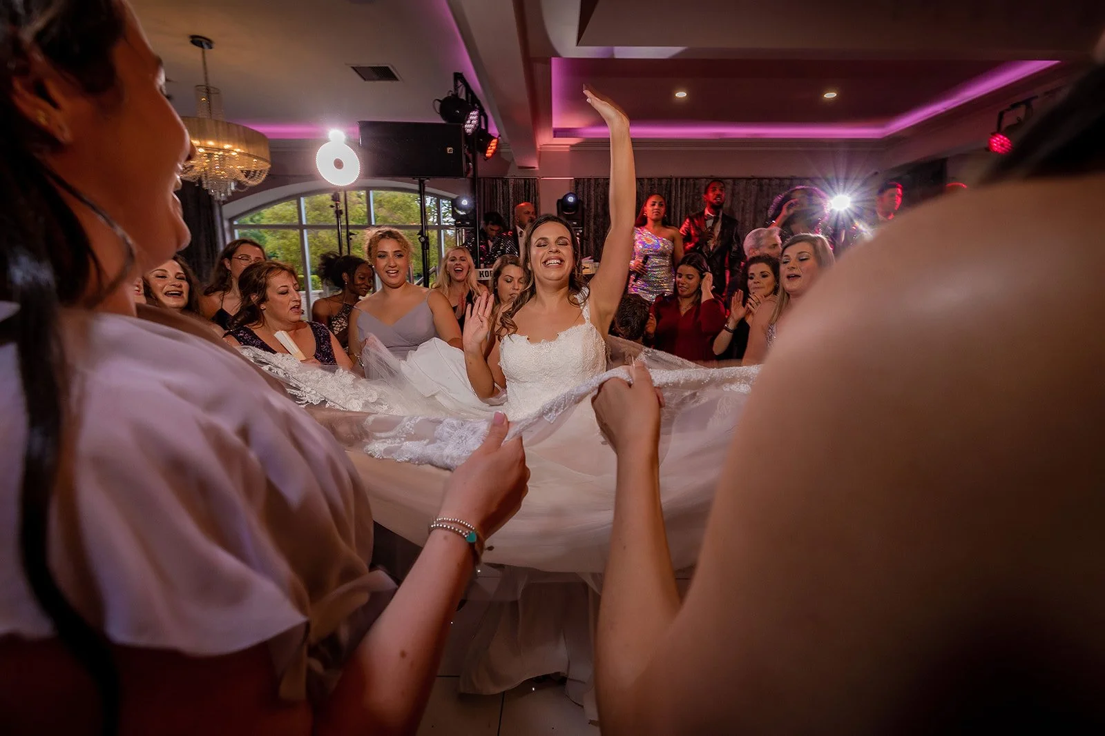 Merrydale Manor wedding bride dancing holding dress at reception – wedding photography North West