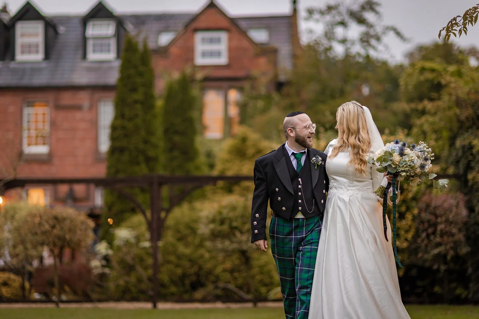 romantic newlywed bride and groom couple portraits italian garden with nunsmere hall in background