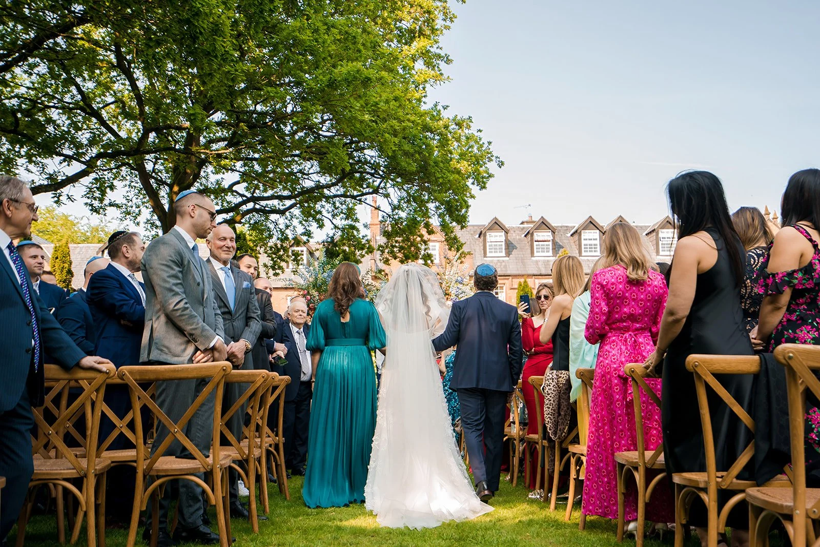 nunsmere-hall-wedding-ceremony-outdoor-bride-groom-exchange-vows-13.jpg