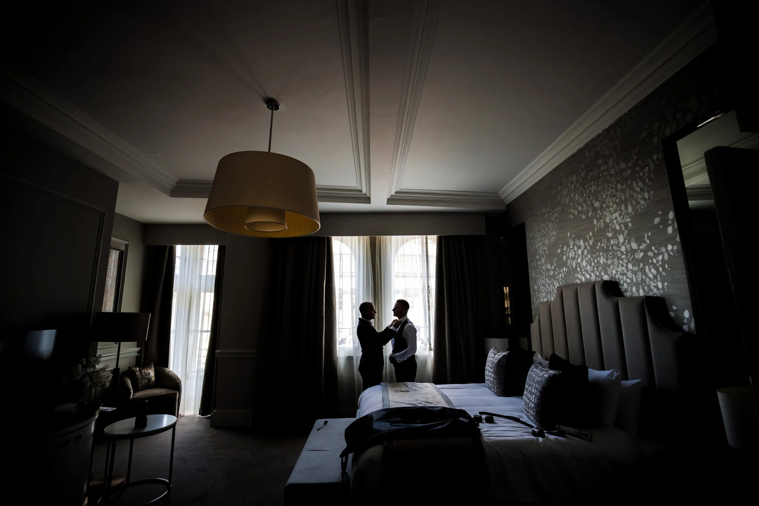 silhouette groom getting ready during groom prep at midland hotel manchester