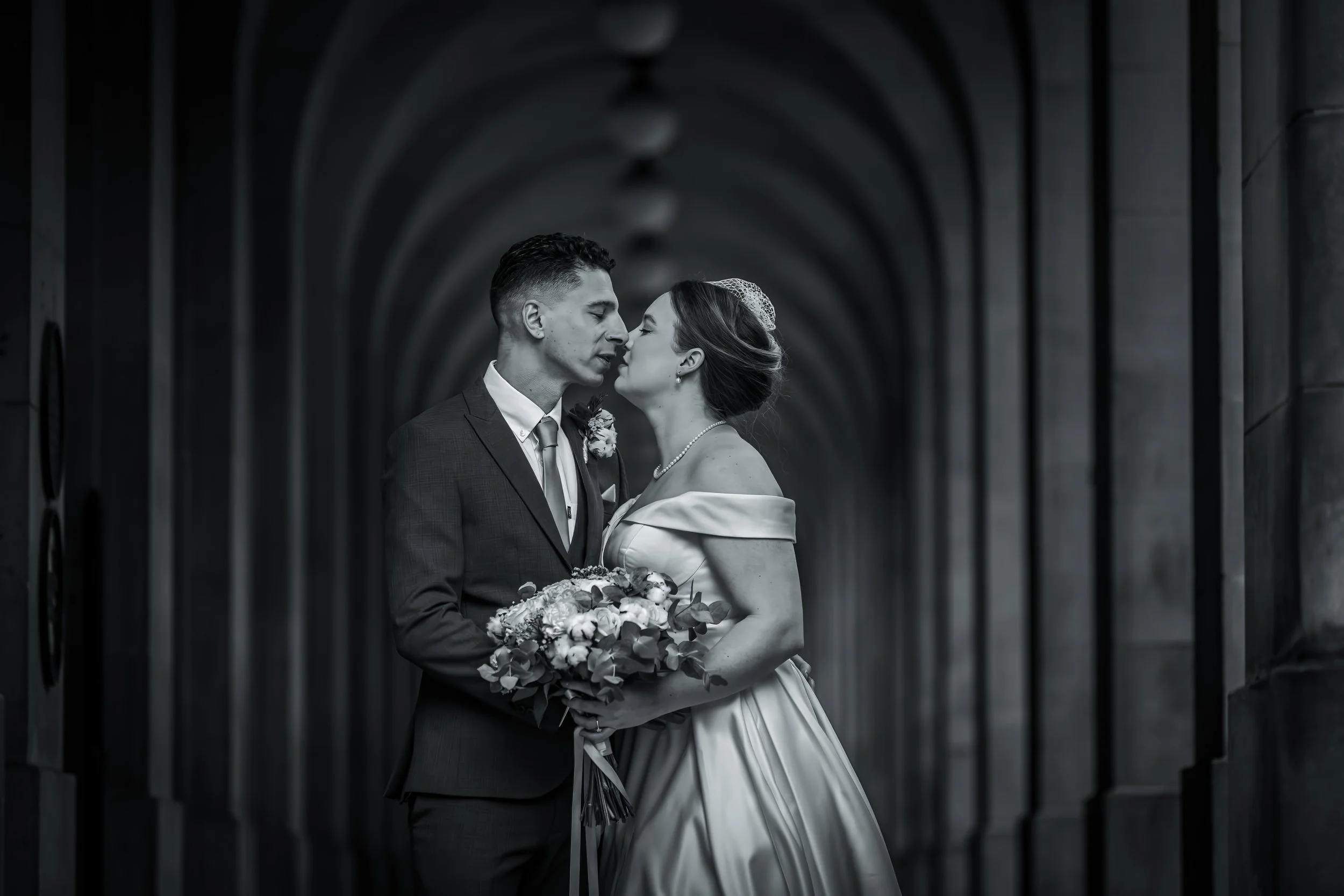 Couple portrait under Manchester arches
