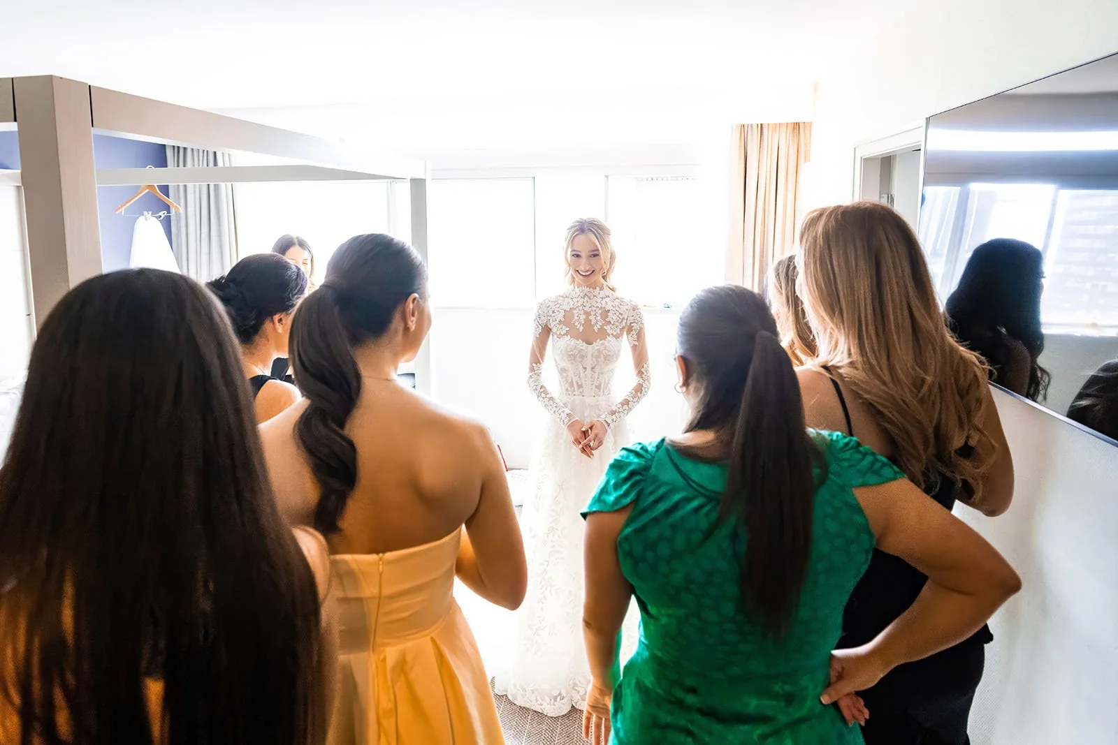 bride first look with friends during prep at mercure manchester piccadilly
