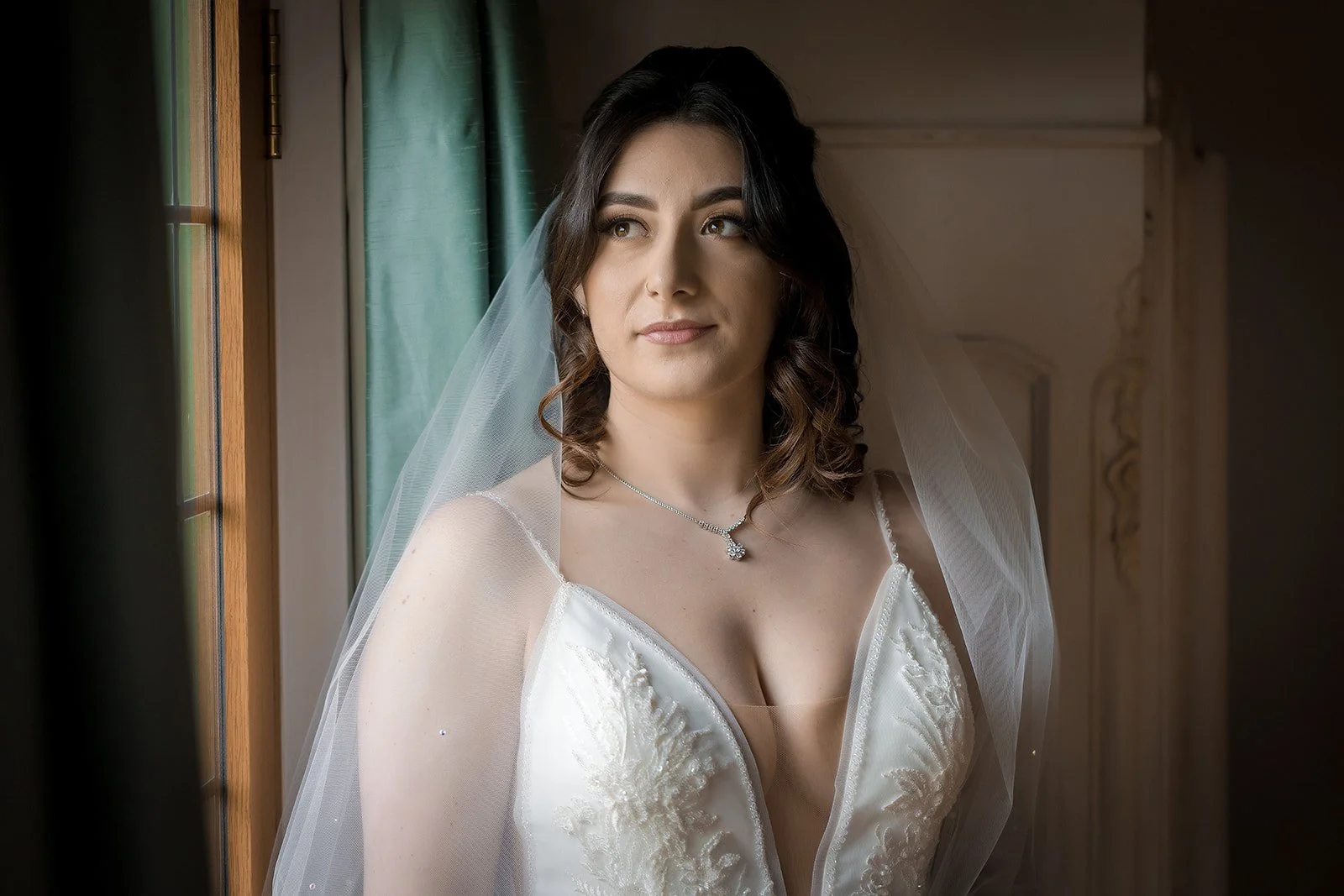 Merrydale Manor wedding bride portrait by window smiling – documentary wedding photographer Manchester