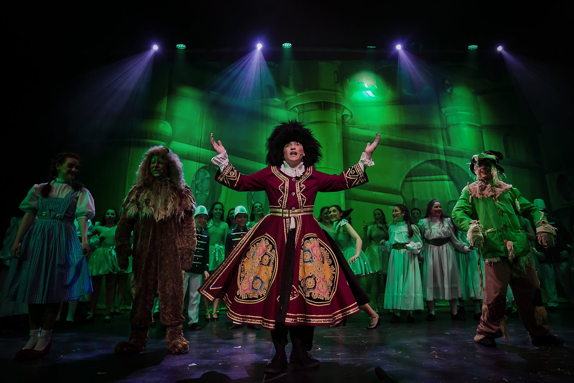 wizard of oz musical stage production photography with lighting and chorus