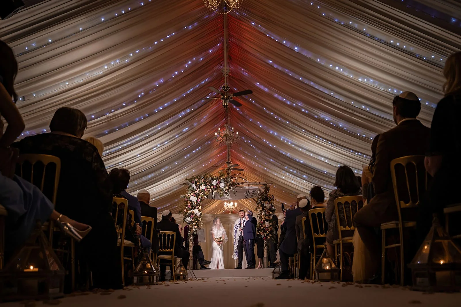 bride and groom exchange vows during wedding ceremony at heaton house farm in macclesfield