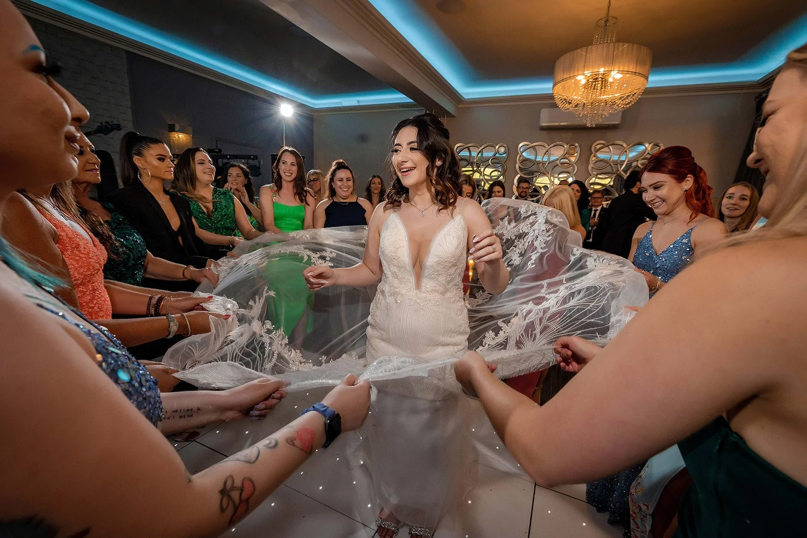 bride has dress fanned out on dance floor during party reception at merrydale manor