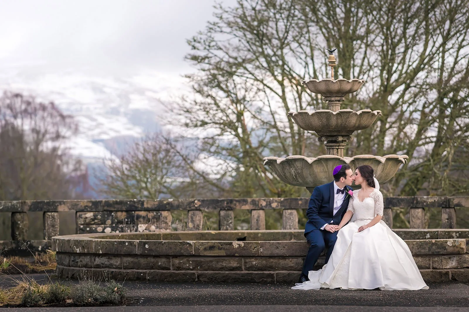 Manchester wedding photographer Jewish bride and groom newlywed couple portraits with snowy mountain background