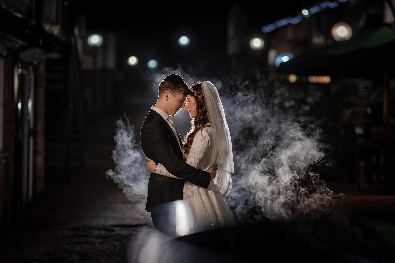 bride and groom newlywed couple portrait with smoke at last drop village wedding venue in bolton