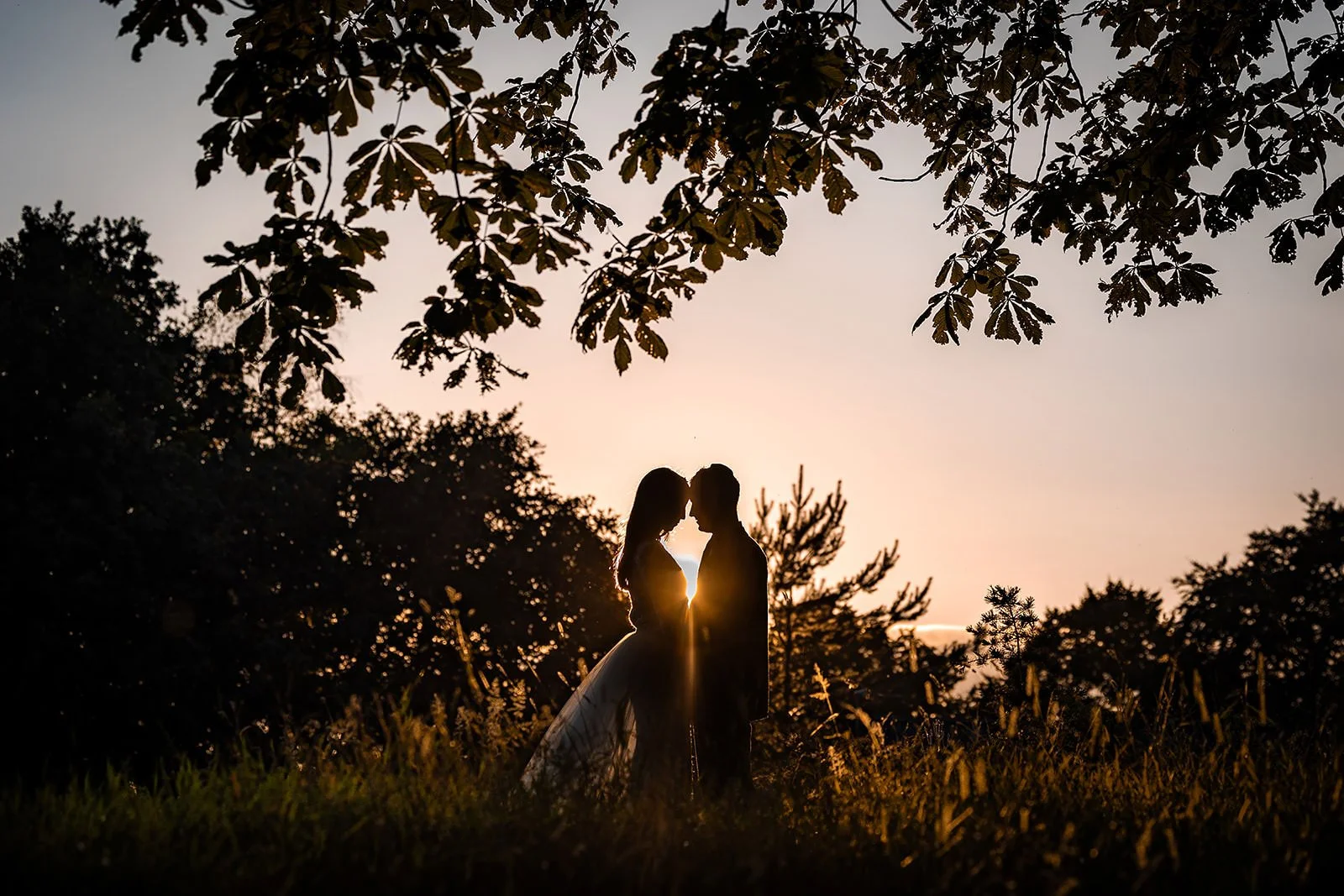 silhouette newlywed bride and groom portrait outdoors at worsley marriott hotel wedding venue