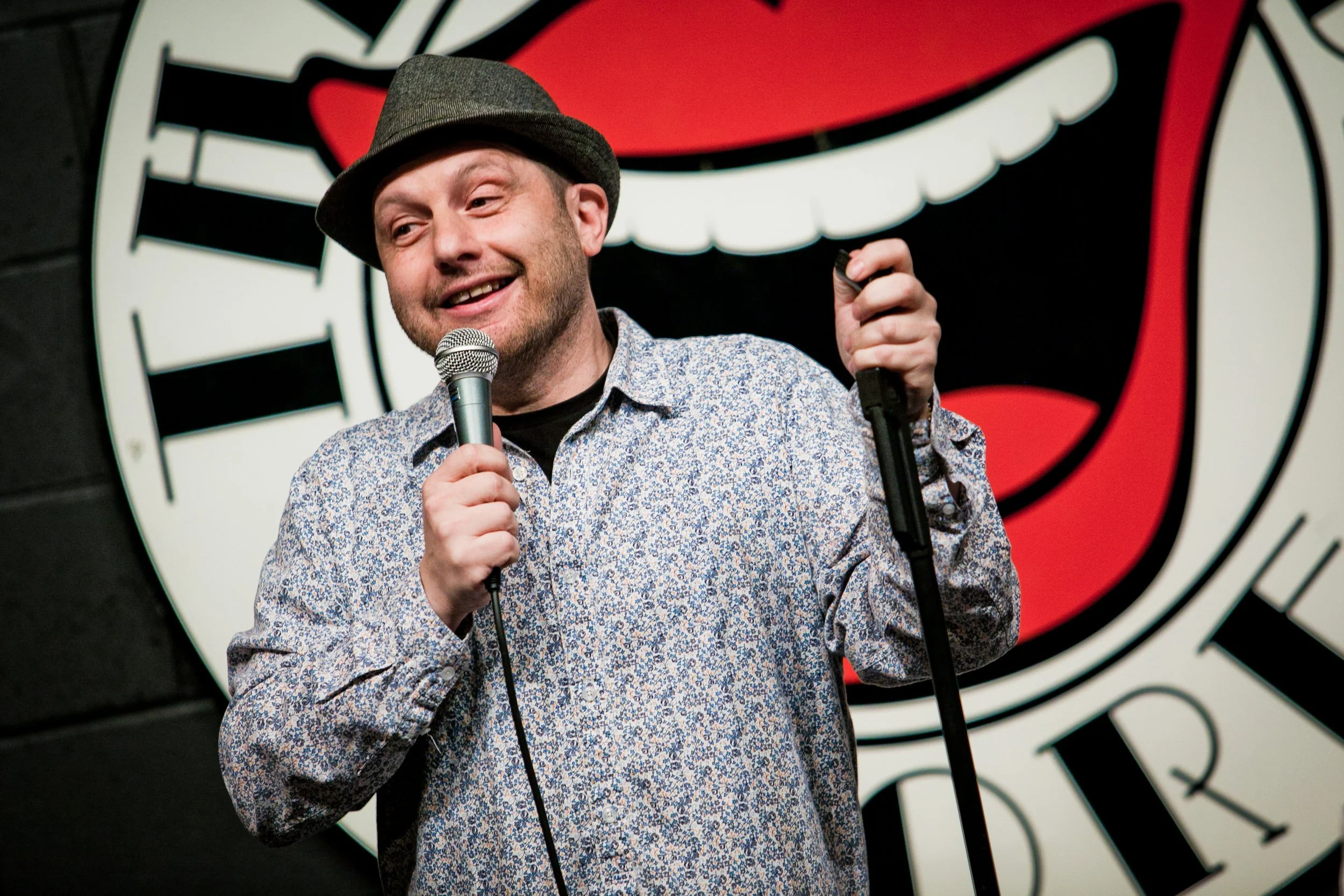 comedian performing in comedy club store