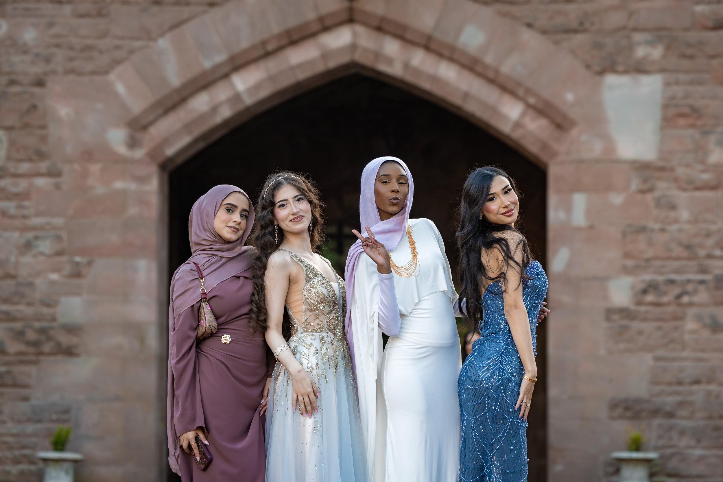Students posing for a group portrait at the Manchester University Law Society Summer Ball at Peckforton Castle