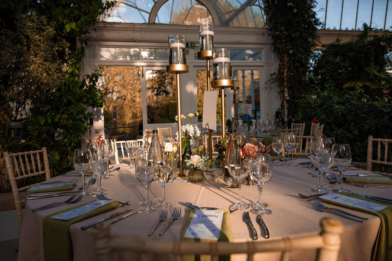 sefton park palm house wedding venue interior set up with tables and decor for reception dinner and dancing