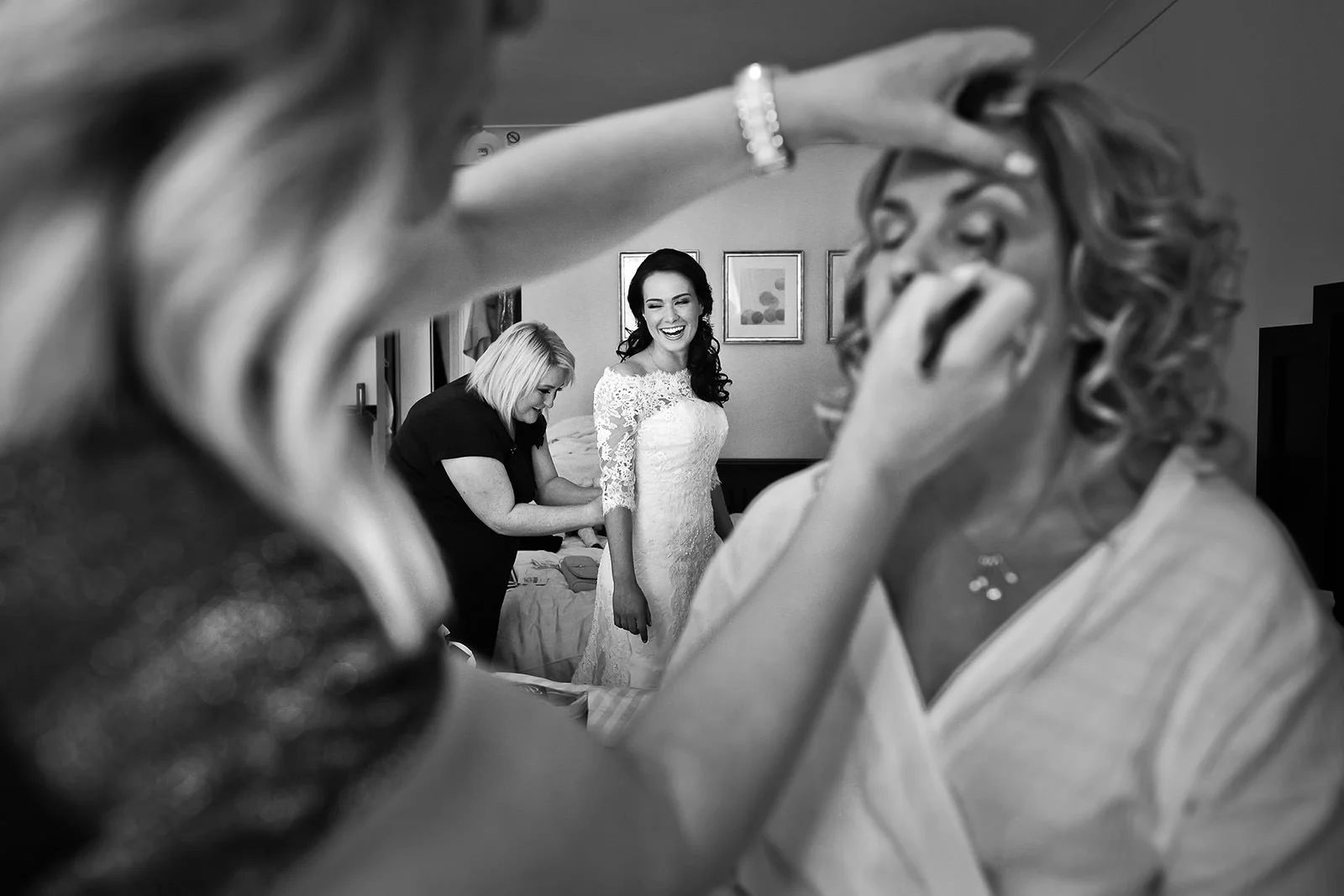 jewish wedding photography Manchester bride framed by MUA during bridal prep