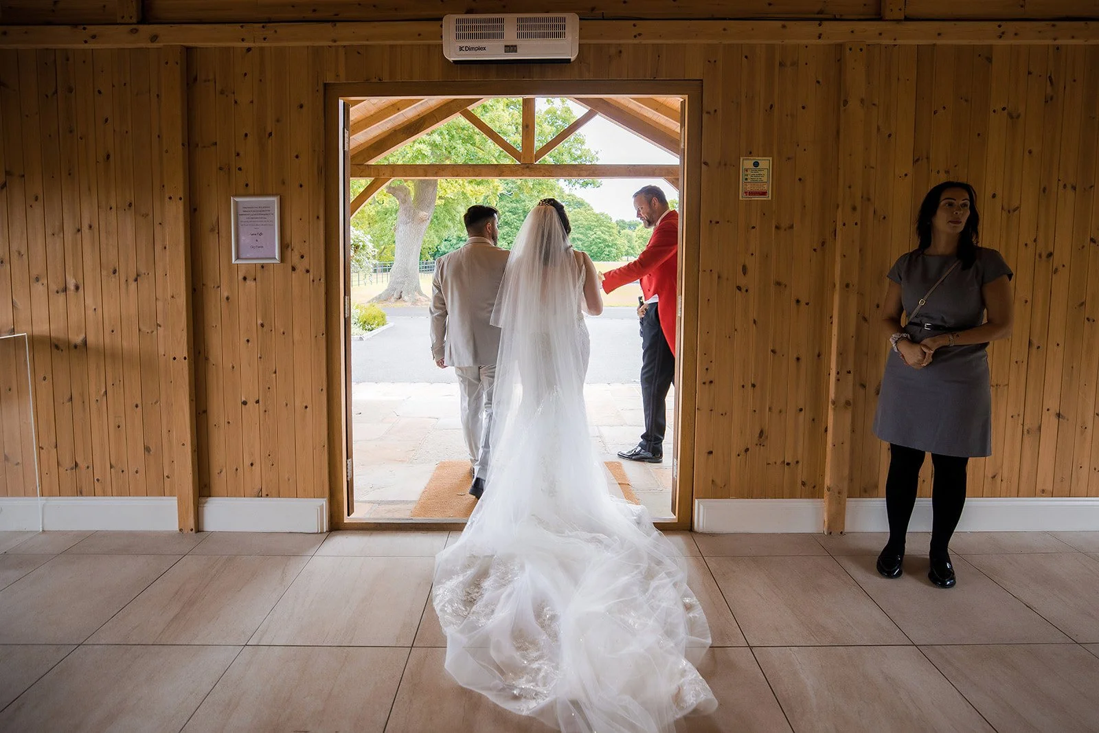 Merrydale Manor wedding bride with long veil at venue entrance – wedding photographer North West England