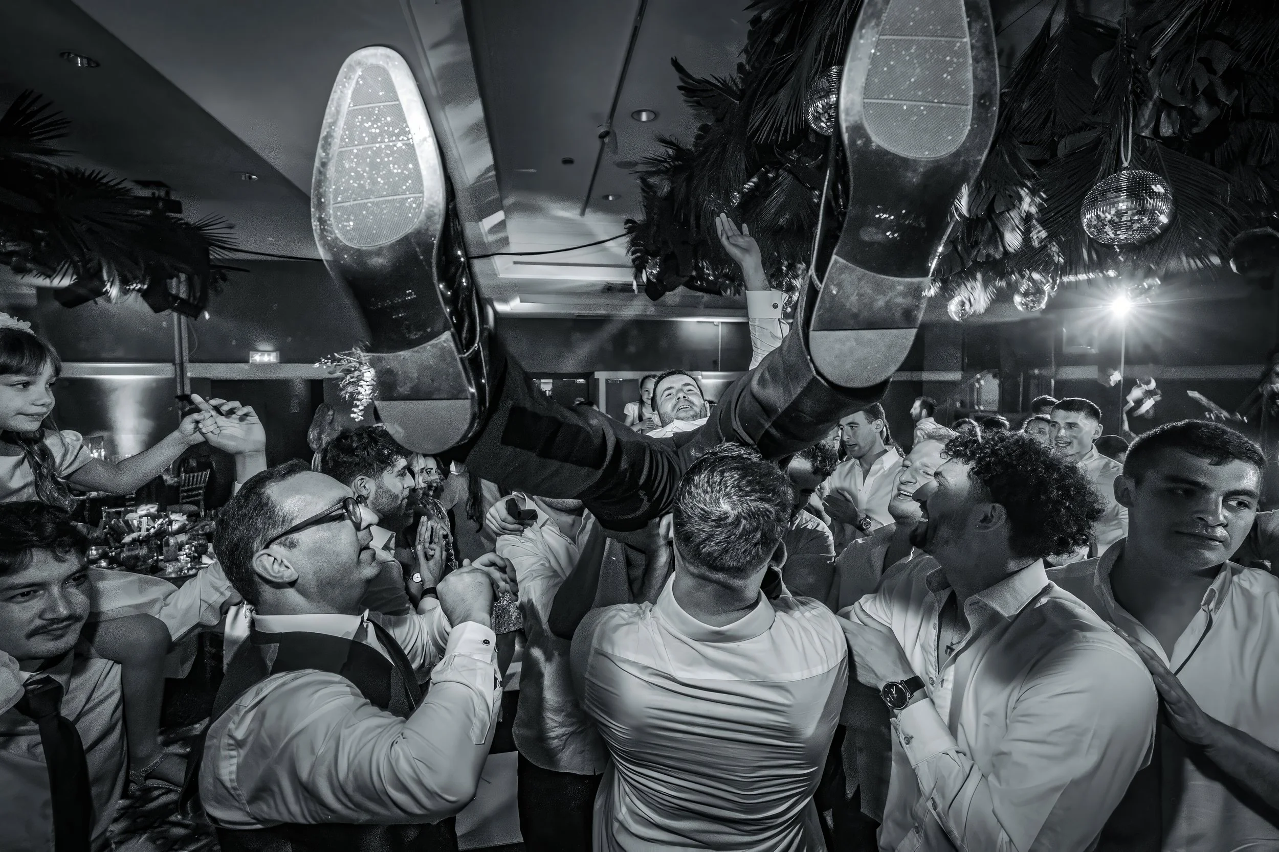 chosson groom thrown in air on dancefloor at charedi jewish wedding