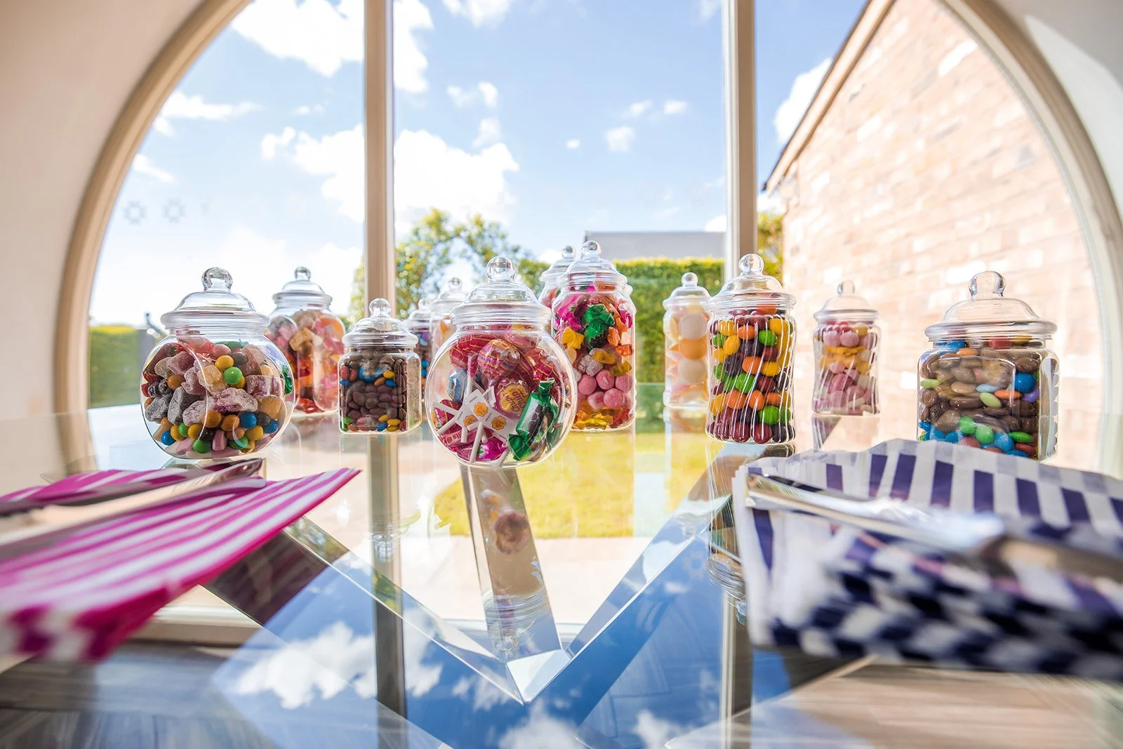 Merrydale Manor wedding candy bar detail with colourful glass jars – wedding photographer North West England