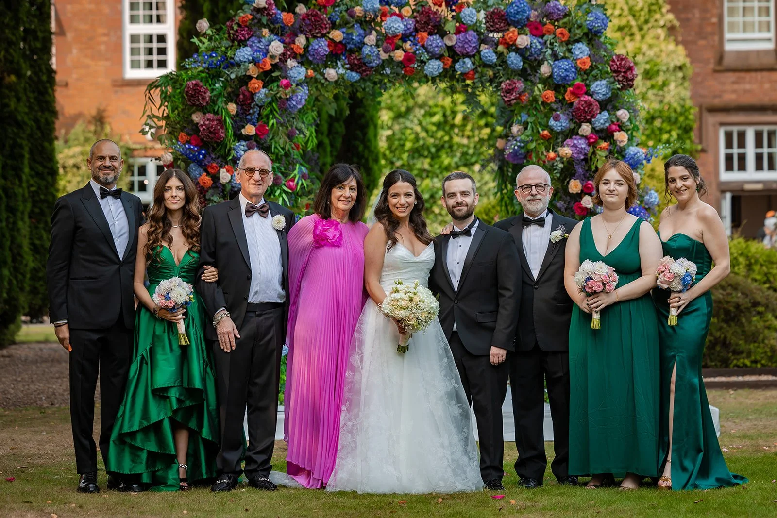 family portraits outdoors in italian gardens at nunsmere hall wedding venue in cheshire