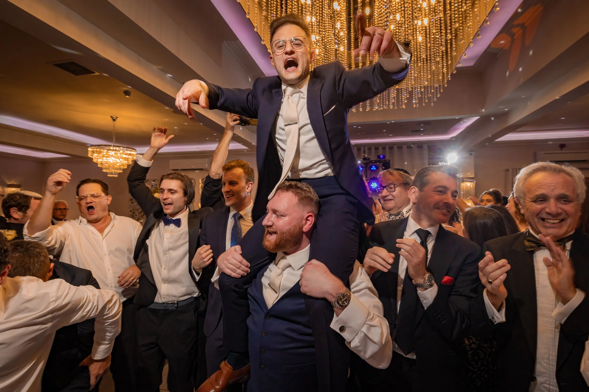 Merrydale Manor wedding groomsmen partying at evening reception – documentary wedding photography Manchester