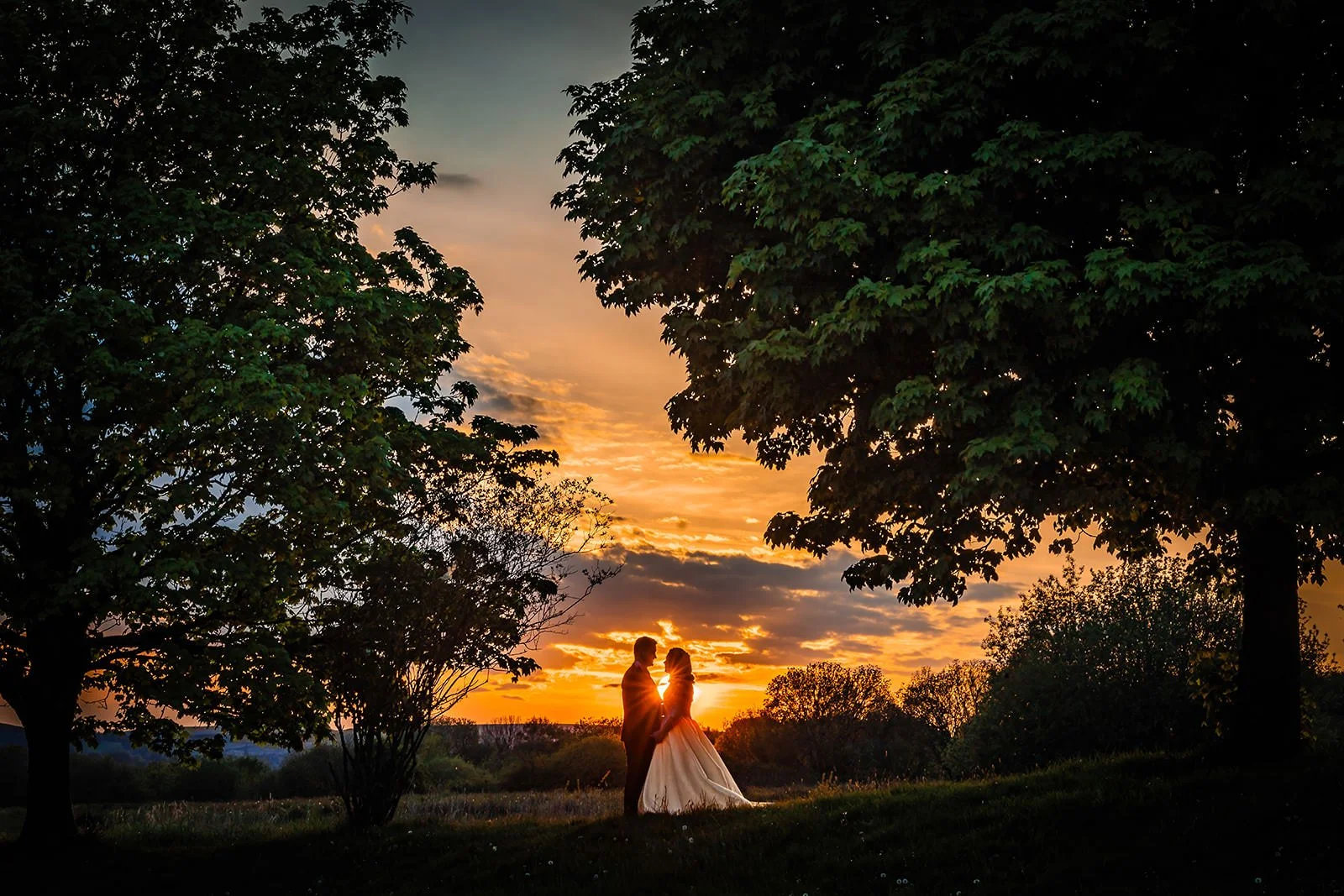 silhouette bride and groom newlywed couple portrait at last drop village wedding venue in bolton