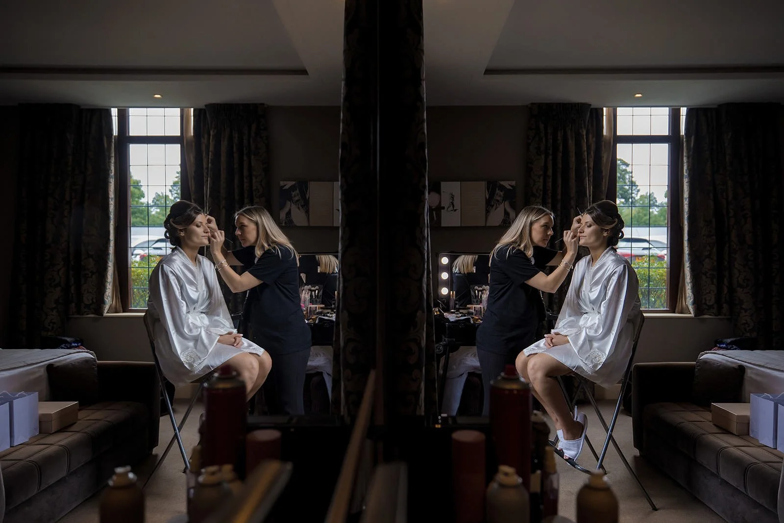 Bride with mirror during morning preparations, The Mere Knutsford
