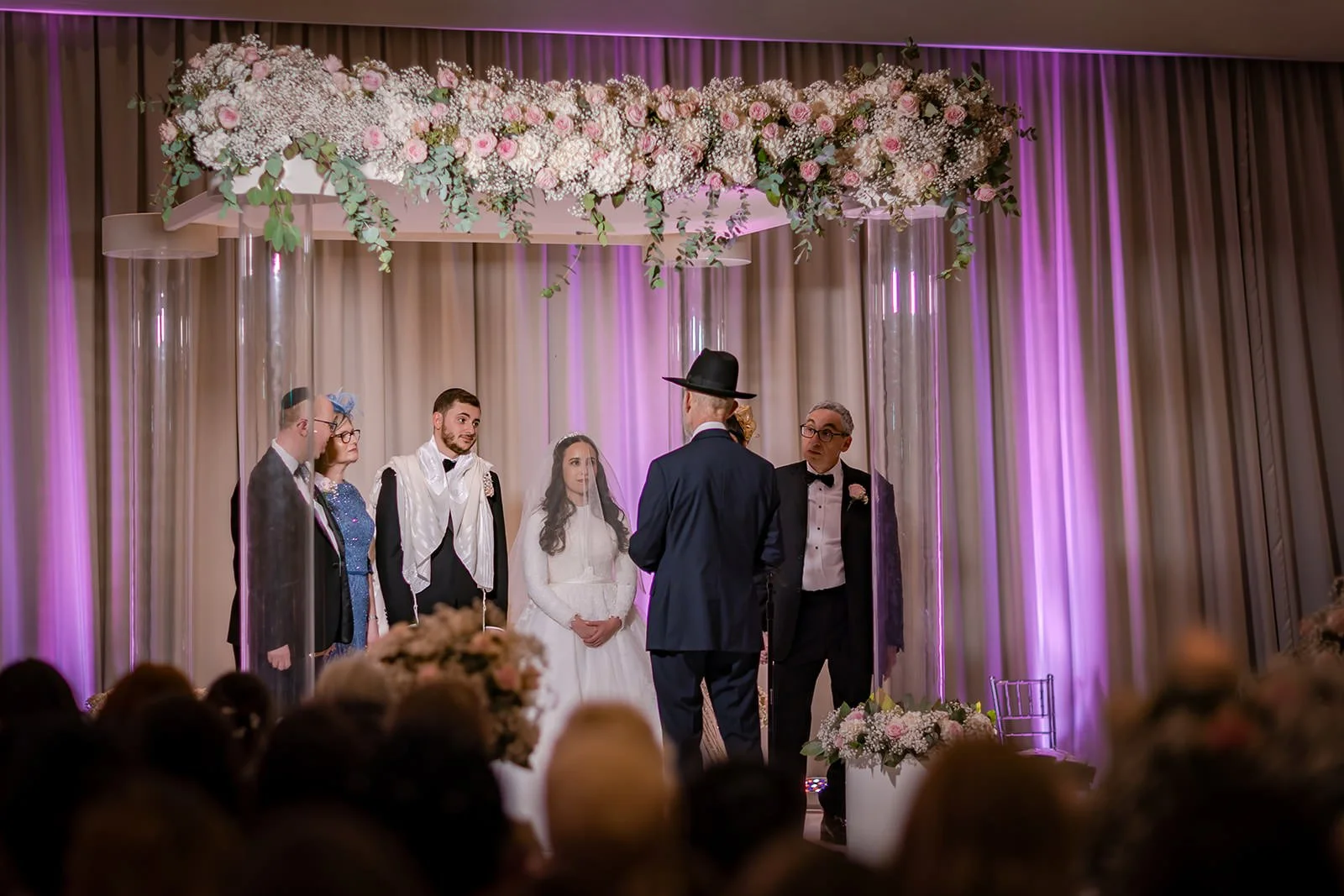 bride and groom exchange vows during wedding ceremony at manchester deansgate hotel