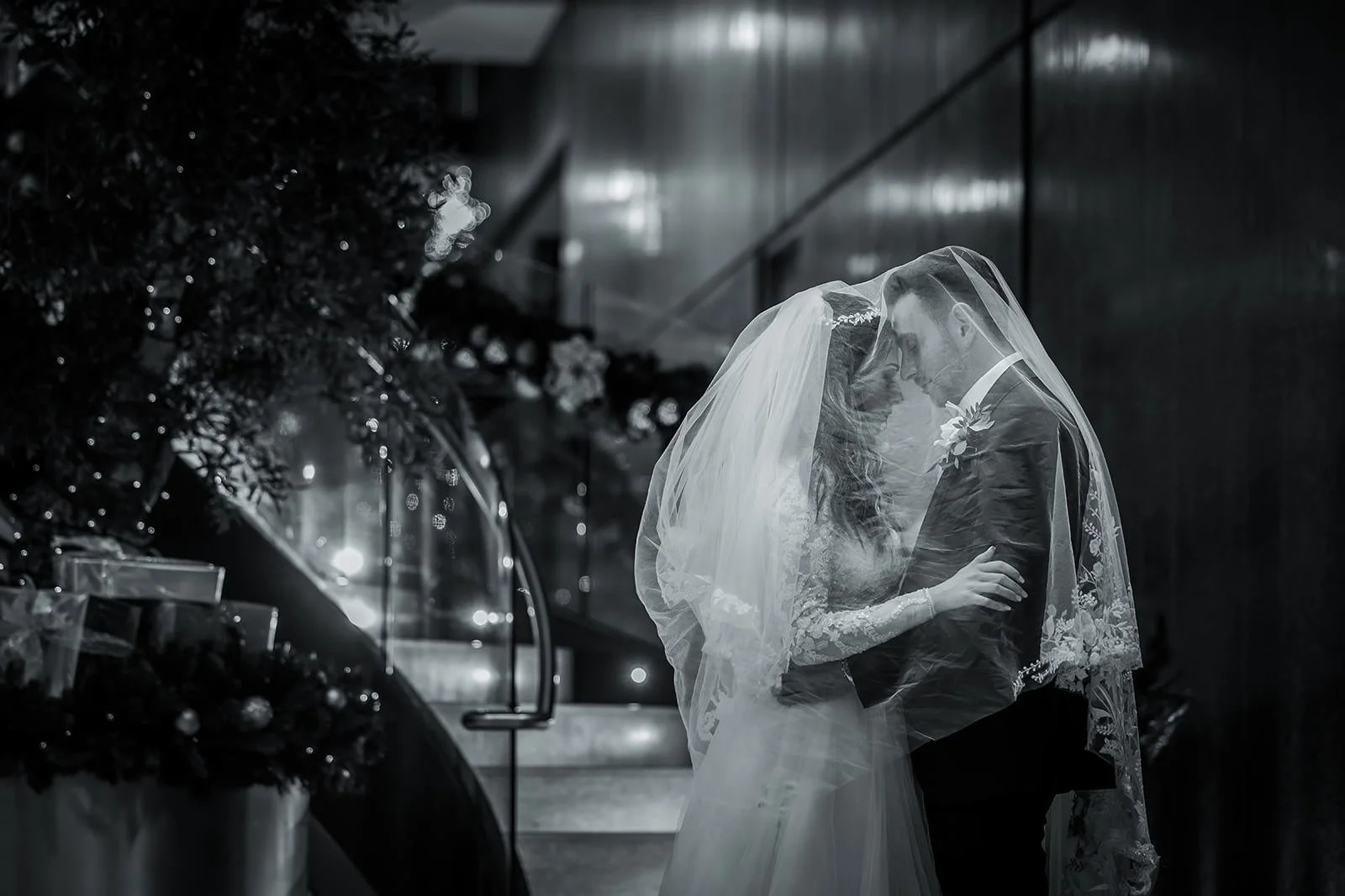 romantic newlywed bride and groom couple portrait with veil in manchester deansgate hotel