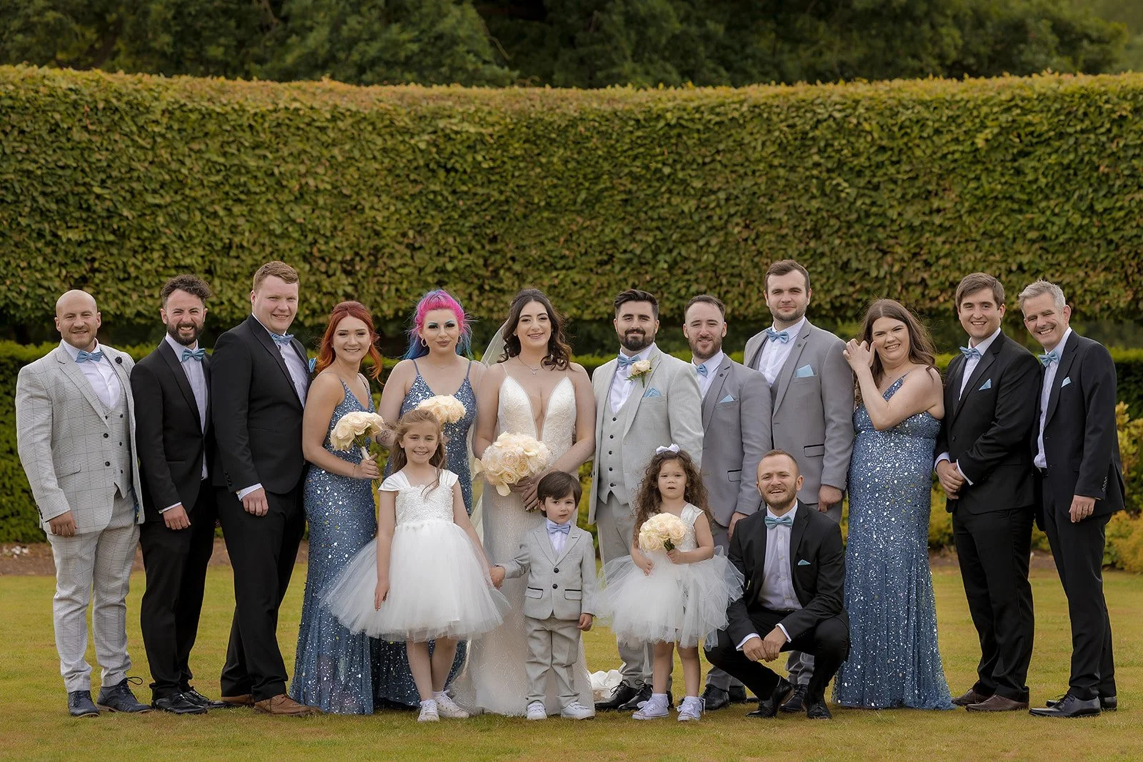 formal family portraits on the lawn during wedding at merrydale manor