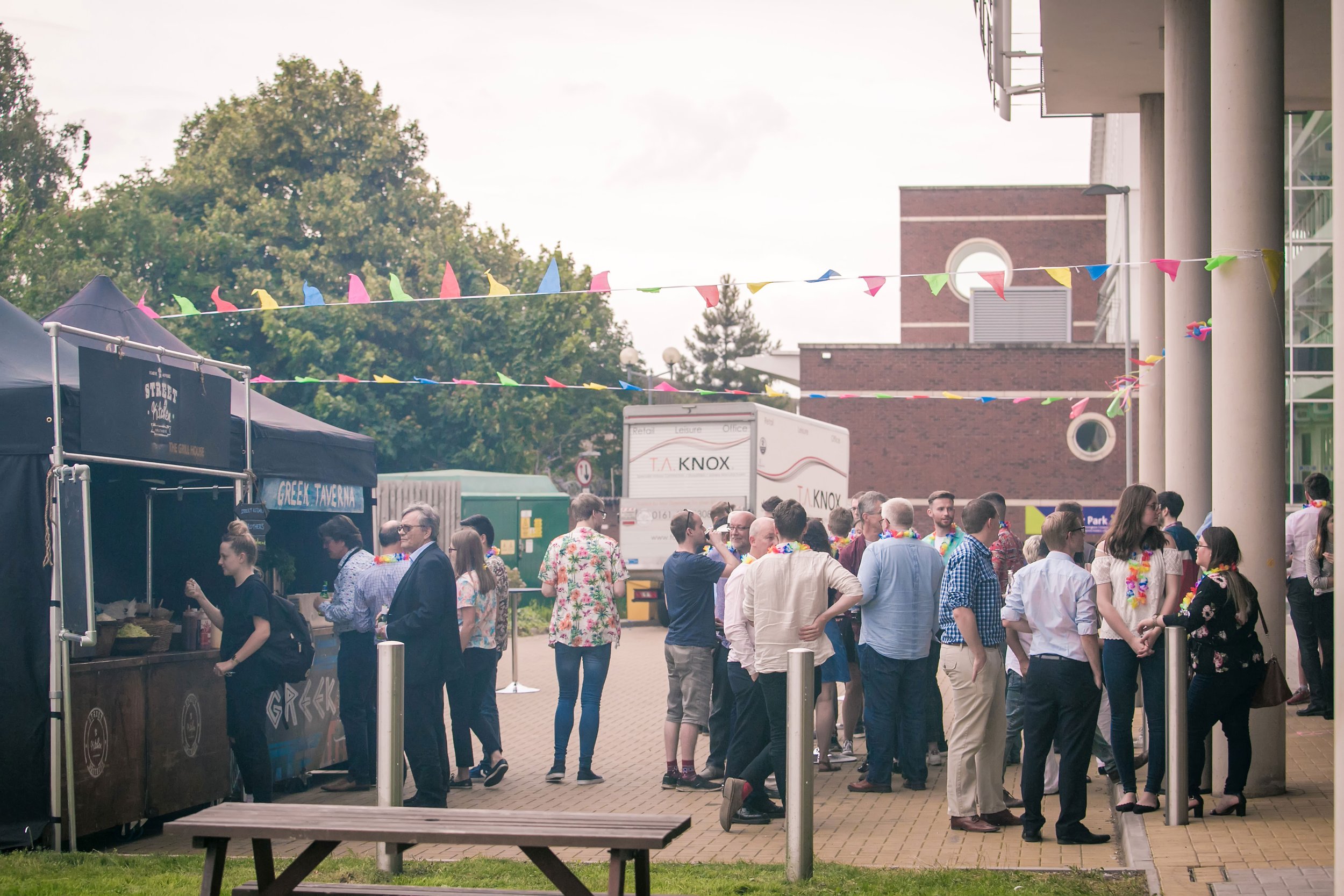 Guests networking at a corporate summer event